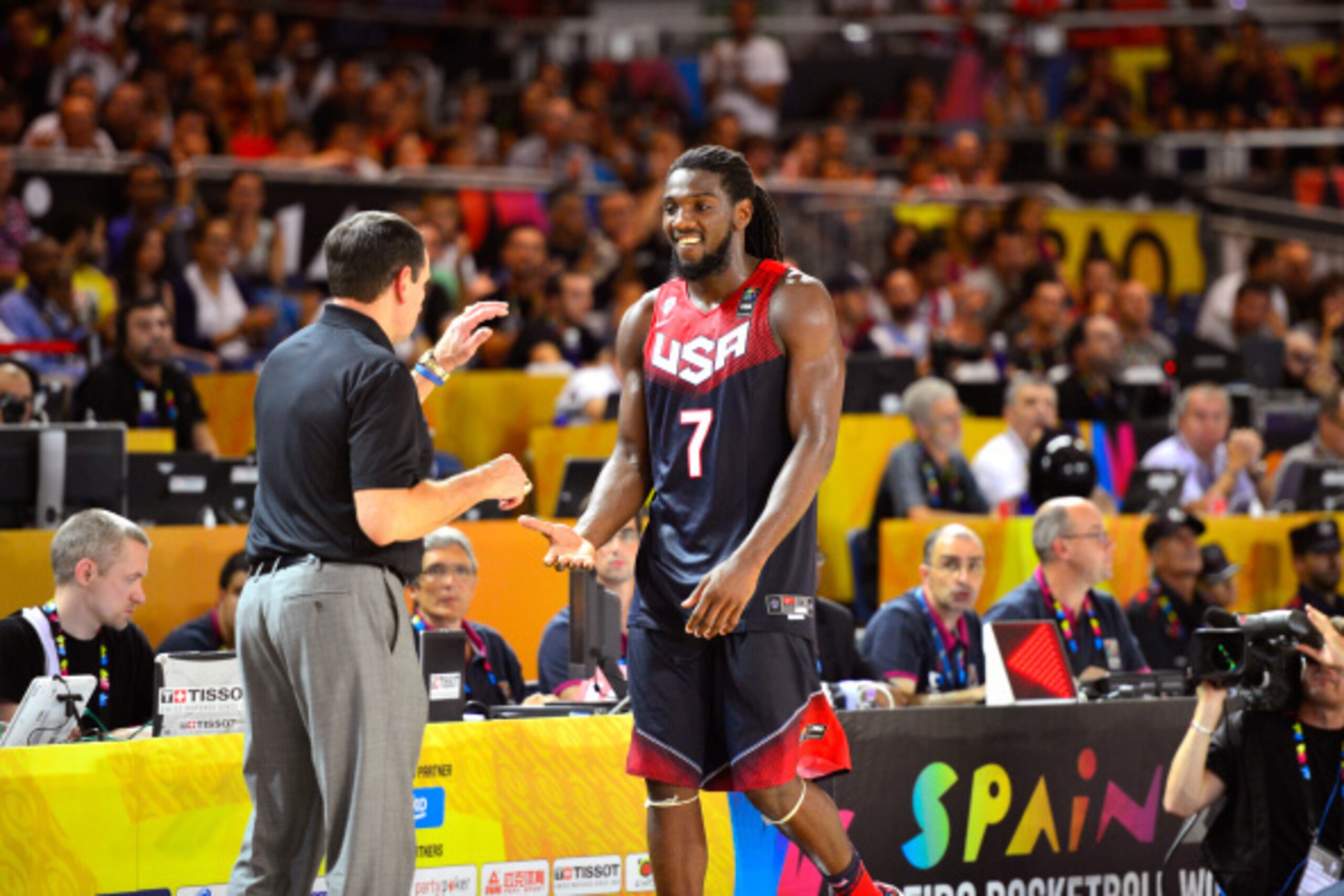 BILBAO, SPAIN - AUGUST 31: Head coach Mike Krzyzewski of the USA Basketball Men's National Team high-fives Kenneth Faried #7 during the game against the Turkey Basketball Men's National Team during the 2014 FIBA World Cup at Bizkaia Arena in Bilbao Exhibi
