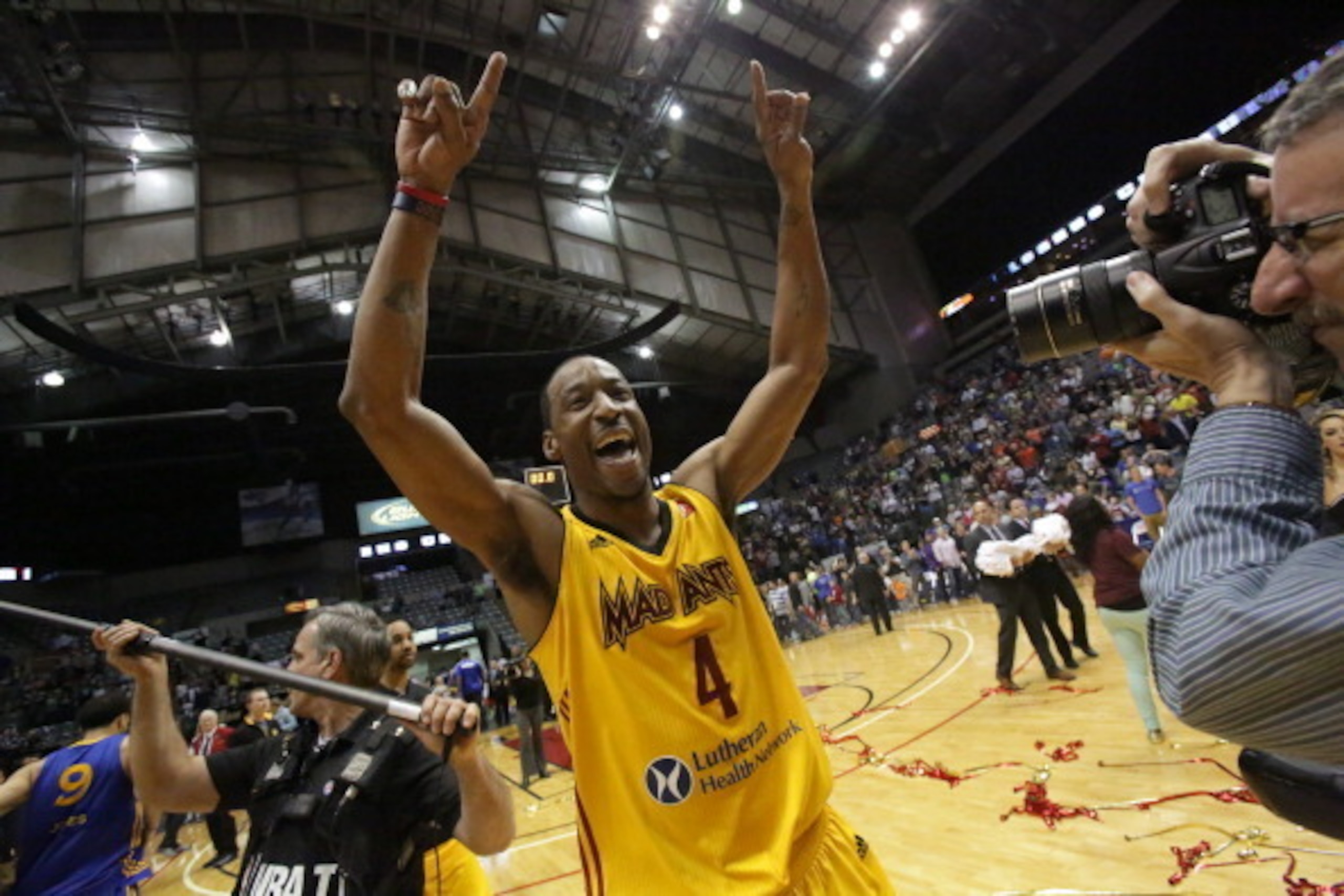 FORT WAYNE, IN - APRIL 26: Chris Porter #4 of the Fort Wayne Mad Ants celebrates after defeating the Santa Cruz Warriors for the National Basketball Developmental League Championship at Allen County Memorial Coliseum on April 26, 2014 in Fort Wayne, India