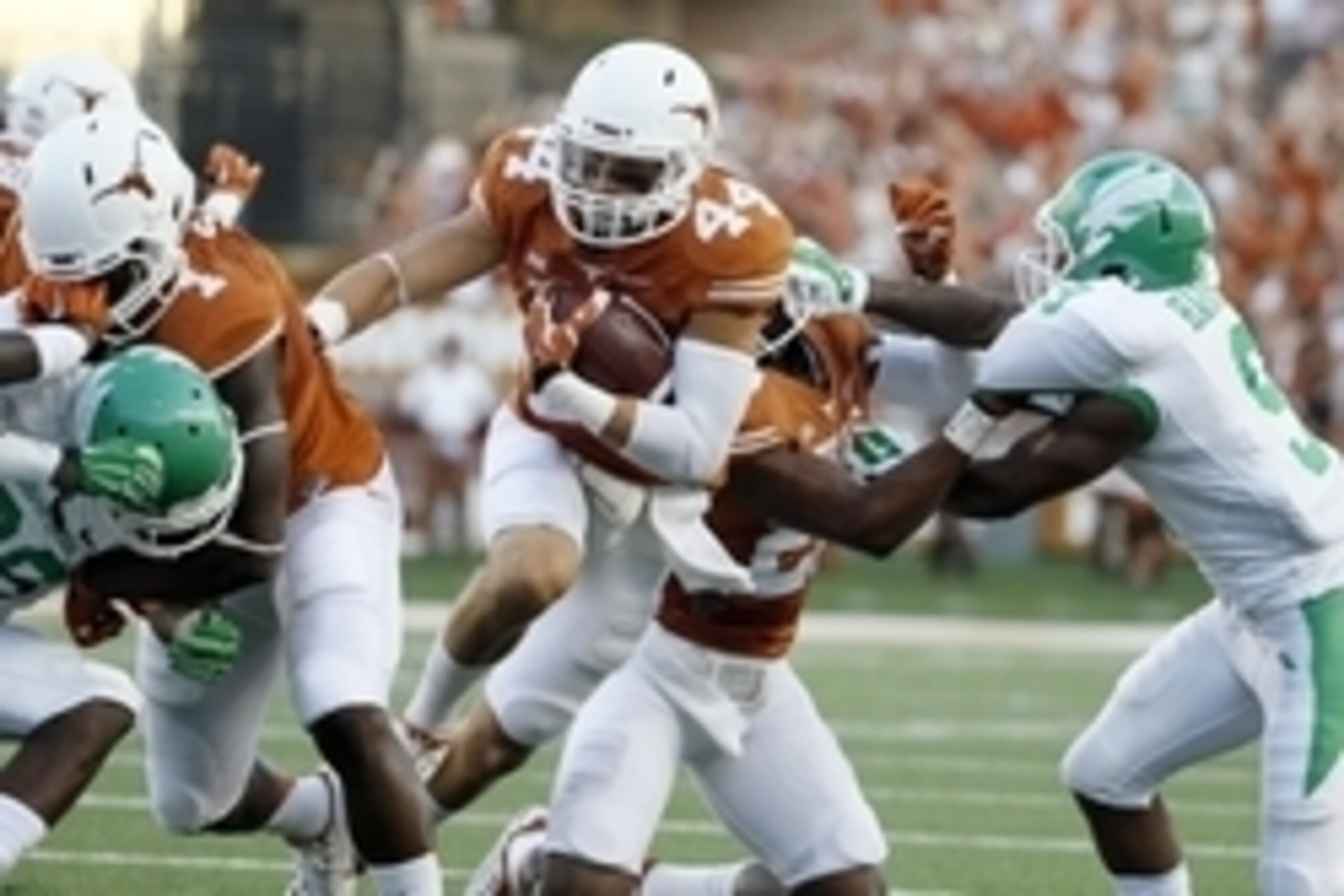Aug 30, 2014; Austin, TX, USA; Texas Longhorns defensive back Dylan Haines (44) run with the ball after an interception against the North Texas Mean Green during the first half at Darrell K Royal-Texas Memorial Stadium. Mandatory Credit: Soobum Im-USA TOD