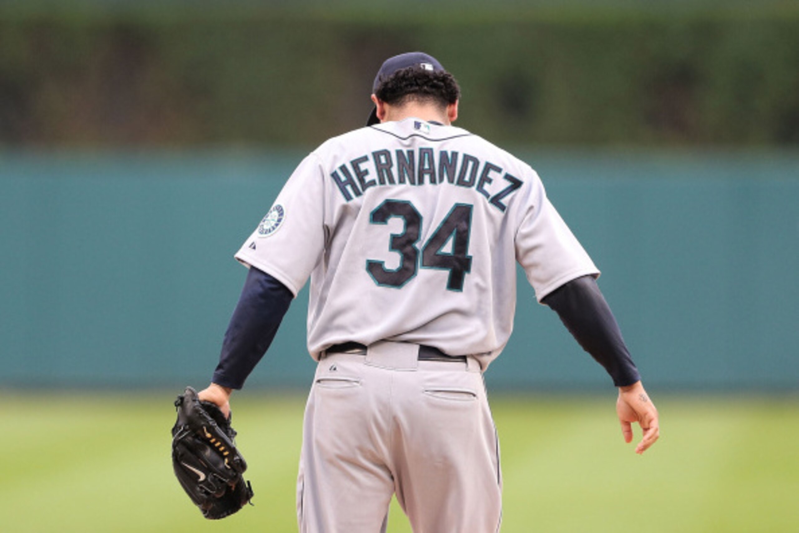 DETROIT, MI - AUGUST 16:  Felix Hernandez #34 of the Seattle Mariners warms up prior to the start of the game against the Detroit Tigers at Comerica Park on August 16, 2014 in Detroit, Michigan. The Tigers defeated the Mariners 4-2.  (Photo by Leon Halip/