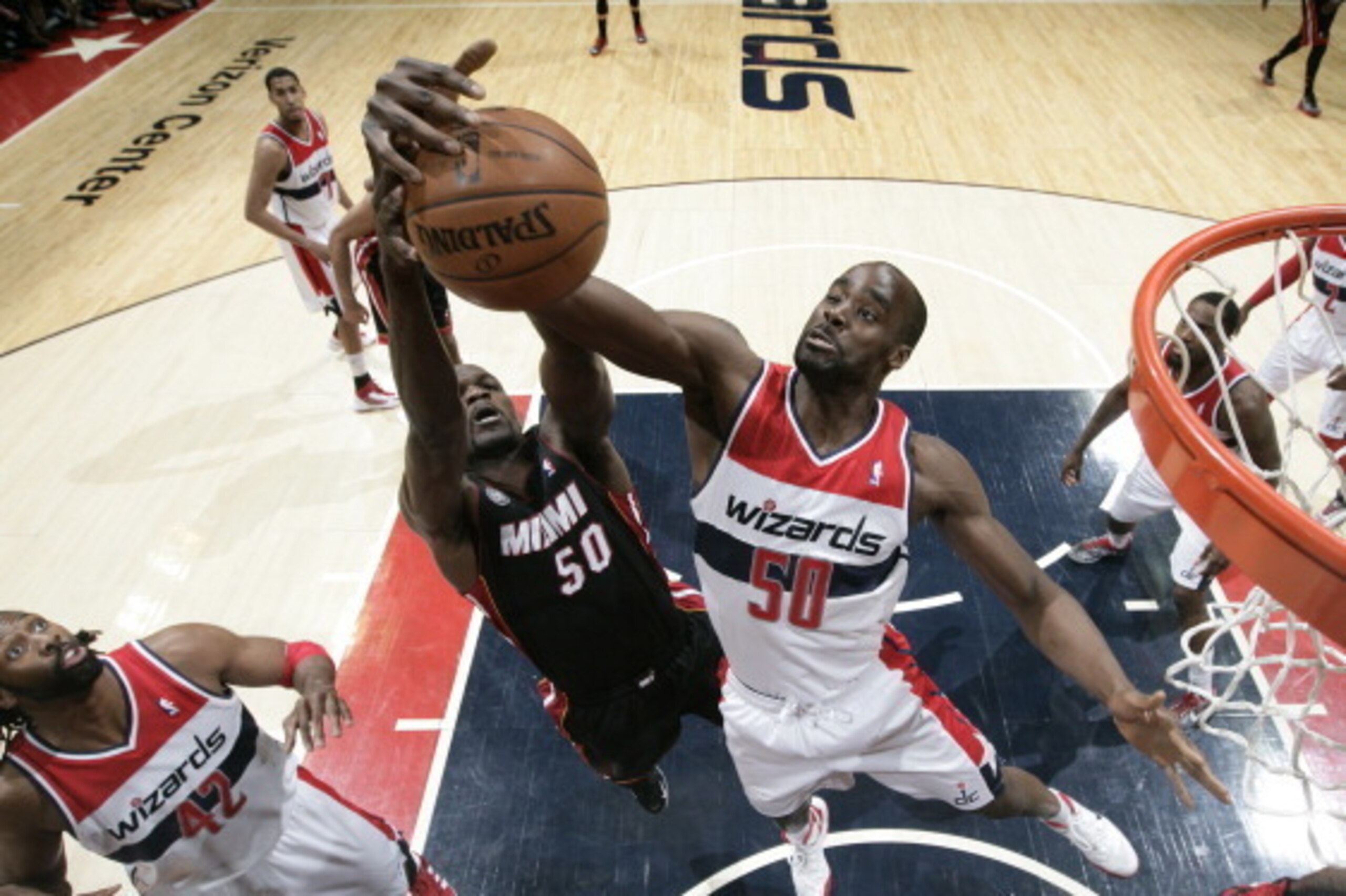 WASHINGTON, DC - APRIL 10: Emeka Okafor #50 of the Washington Wizards rebounds against Joel Anthony #50 of the Miami Heat during the game at the Verizon Center on April 10, 2013 in Washington, DC. NOTE TO USER: User expressly acknowledges and agrees that, WASHINGTON, DC - APRIL 10: Emeka Okafor #50 of the Washington Wizards rebounds against Joel Anthony #50 of the Miami Heat during the game at the Verizon Center on April 10, 2013 in Washington, DC. NOTE TO USER: User expressly acknowledges and agrees that,