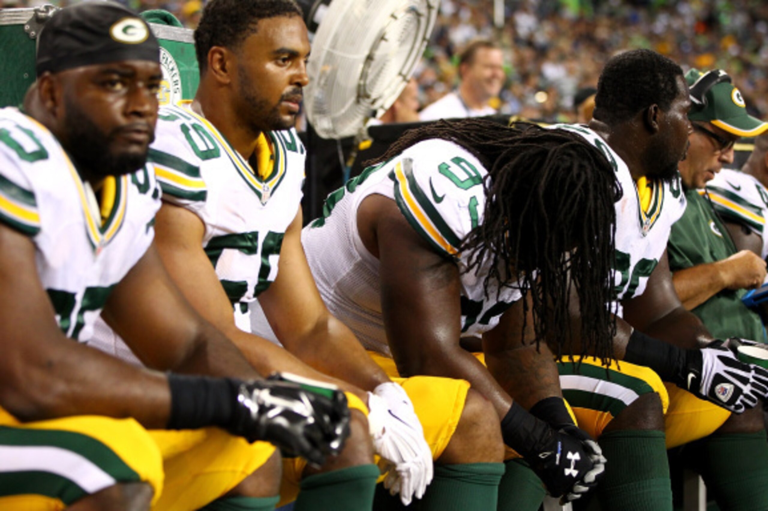 SEATTLE - SEPTEMBER 04:  Josh Boyd #93 of the Green Bay Packers hnags his head on dejection on the bench during the game against he Seattle Seahawks at Century Link Field on September 4, 2014 in Seattle, Washington.  (Photo by Jonathan Ferrey/Getty Images