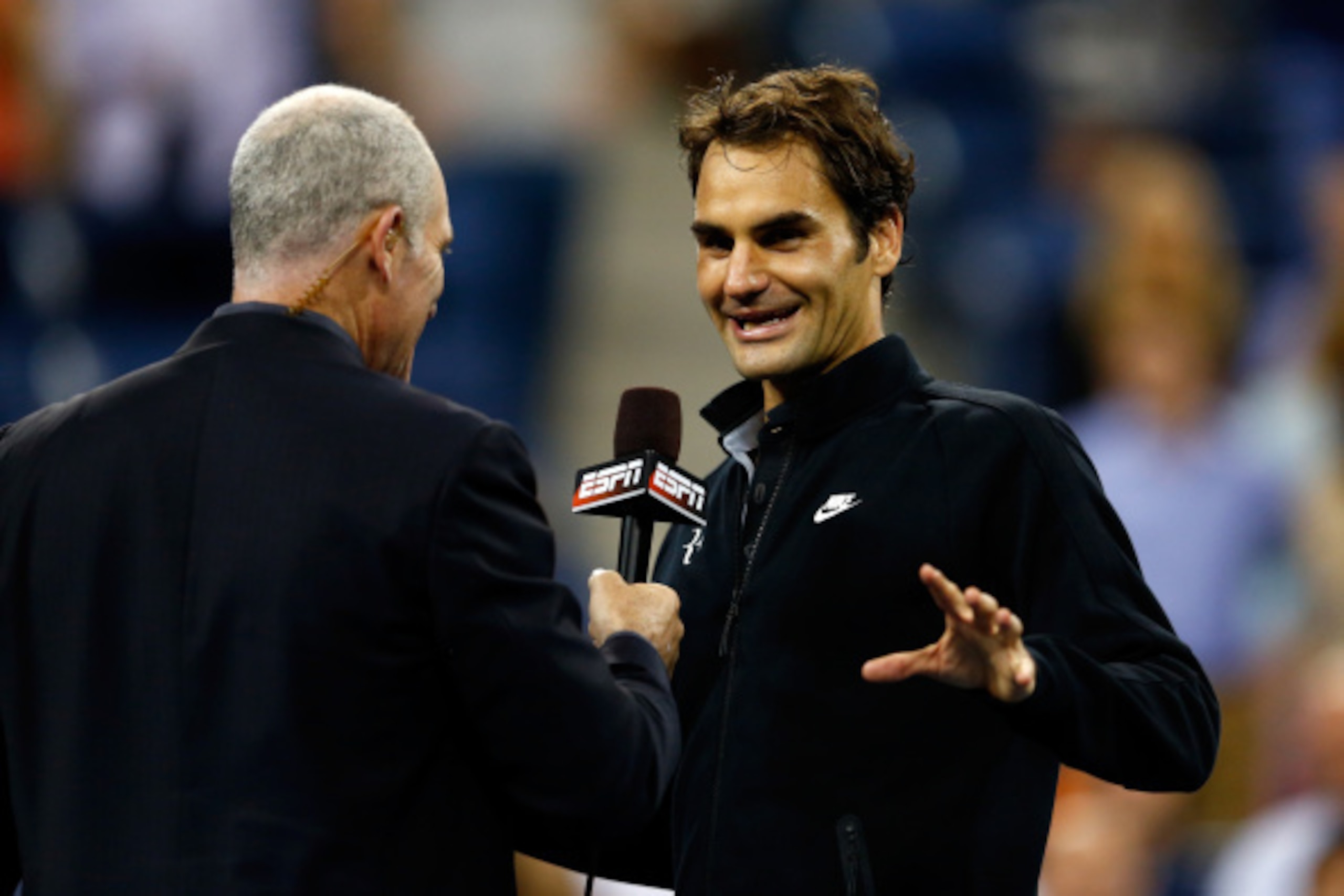 NEW YORK, NY - SEPTEMBER 04:  Roger Federer (R) of Switzerland talks with Brad Gilbert after defeating Gael Monfils of France during their men's singles quarterfinal match on Day Eleven of the 2014 US Open at the USTA Billie Jean King National Tennis Cent