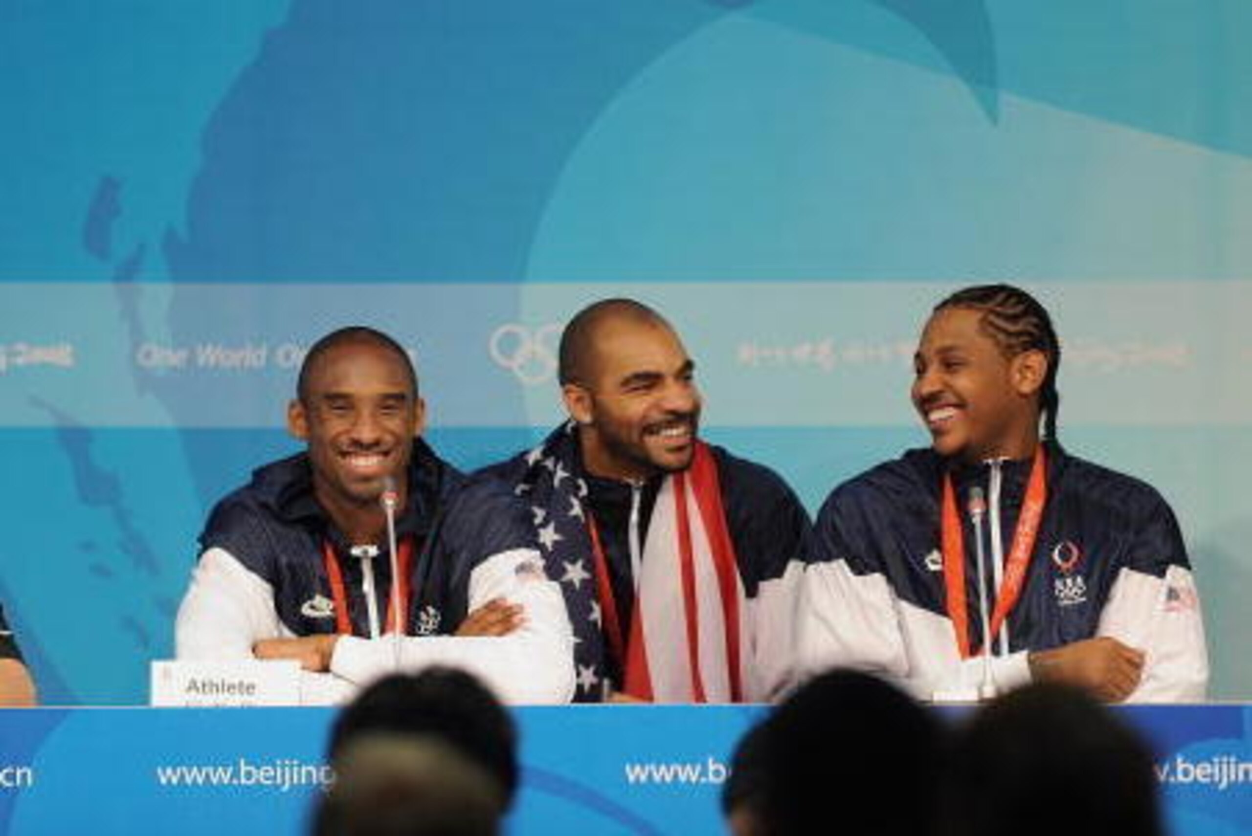 BEIJING - AUGUST 24:  (L-R) Head Coach Mike Krzyzewski, Kobe Bryant #10, Carlos Boozer #4, and Carmelo Anthony #15 of the United States talk to the press of the 2008 Beijing Summer Olympics against Spain at the Beijing Olympic Basketball Gymnasium on Augu