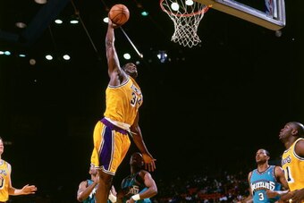 LOS ANGELES - 1999:  Shaquille O'Neal #34 of the Los Angeles Lakers goes for a dunk against the Vancouver Grizzlies during an NBA game circa 1999 at the Forum in Los Angeles, California. NOTE TO USER: User expressly acknowledges and agrees that, by downlo