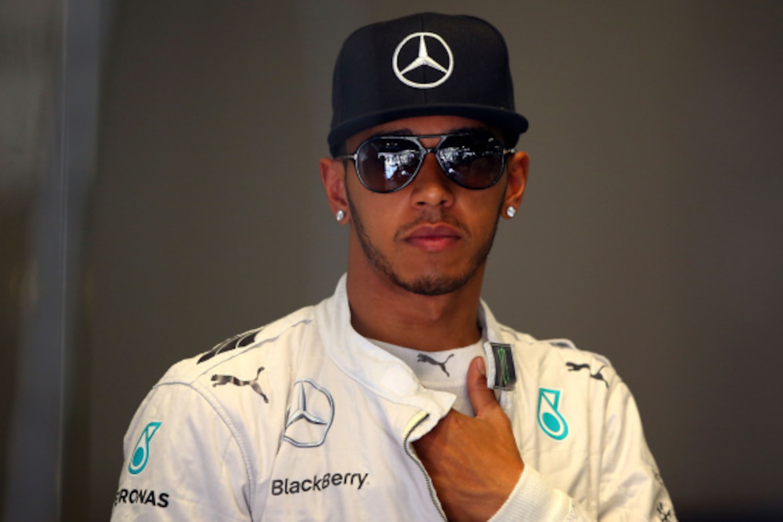 MONZA, ITALY - SEPTEMBER 05:  Lewis Hamilton of Great Britain and Mercedes GP looks on from the team garage during Practice ahead of the F1 Grand Prix of Italy at Autodromo di Monza on September 5, 2014 in Monza, Italy.  (Photo by Bryn Lennon/Getty Images