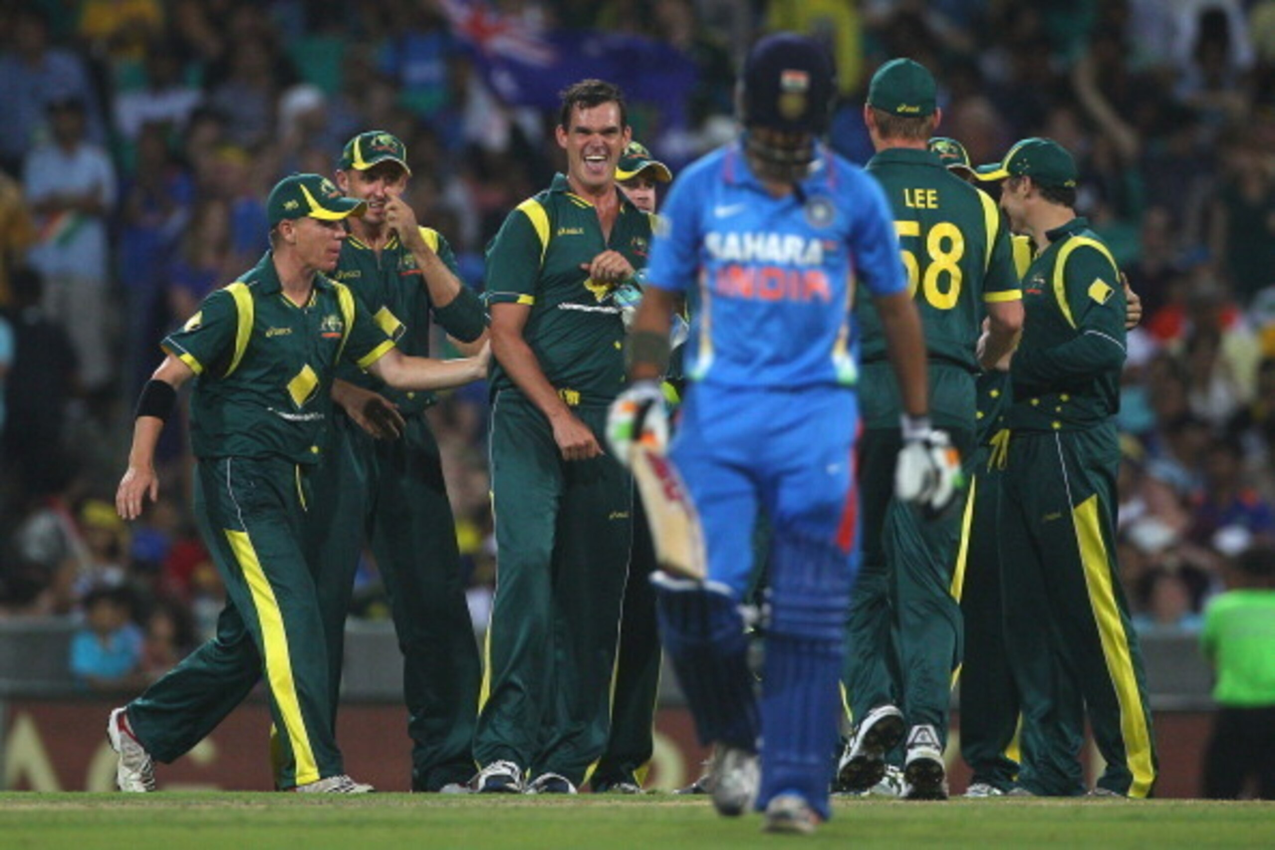 SYDNEY, AUSTRALIA - FEBRUARY 26:  Clint McKay of Australia is congratulated by team mates after taking the wicket of Gautam Gambhir of India during the One Day International match between Australia and India at the Sydney Cricket Ground on February 26, 20