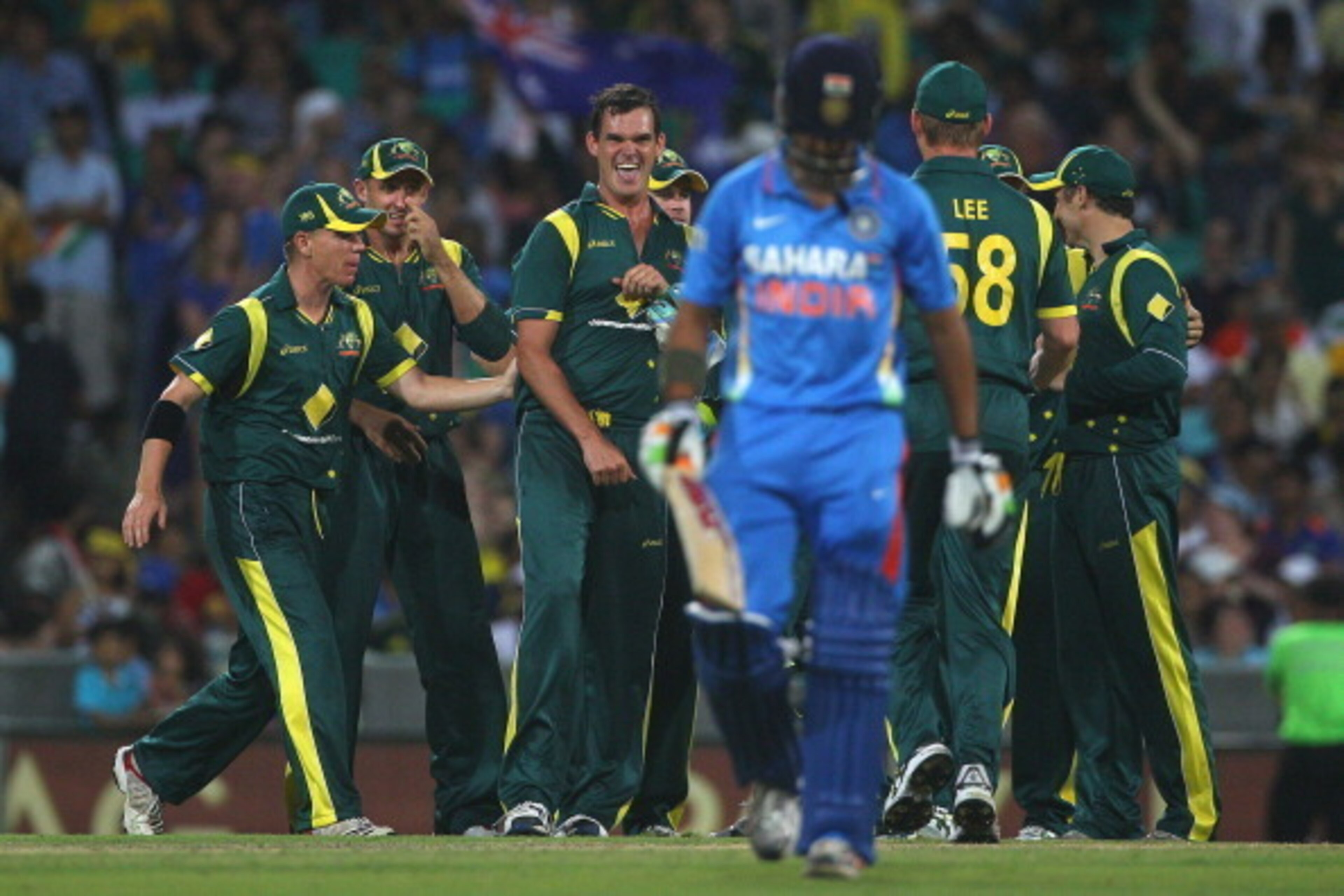 SYDNEY, AUSTRALIA - FEBRUARY 26:  Clint McKay of Australia is congratulated by team mates after taking the wicket of Gautam Gambhir of India during the One Day International match between Australia and India at the Sydney Cricket Ground on February 26, 20