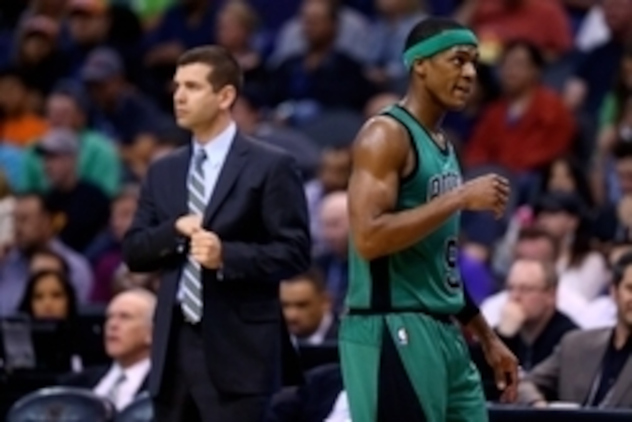 Feb 19, 2014; Phoenix, AZ, USA; Boston Celtics guard Rajon Rondo (9) walks past head coach Brad Stevens against the Phoenix Suns at US Airways Center. The Suns defeated the Celtics 100-94. Mandatory Credit: Mark J. Rebilas-USA TODAY Sports