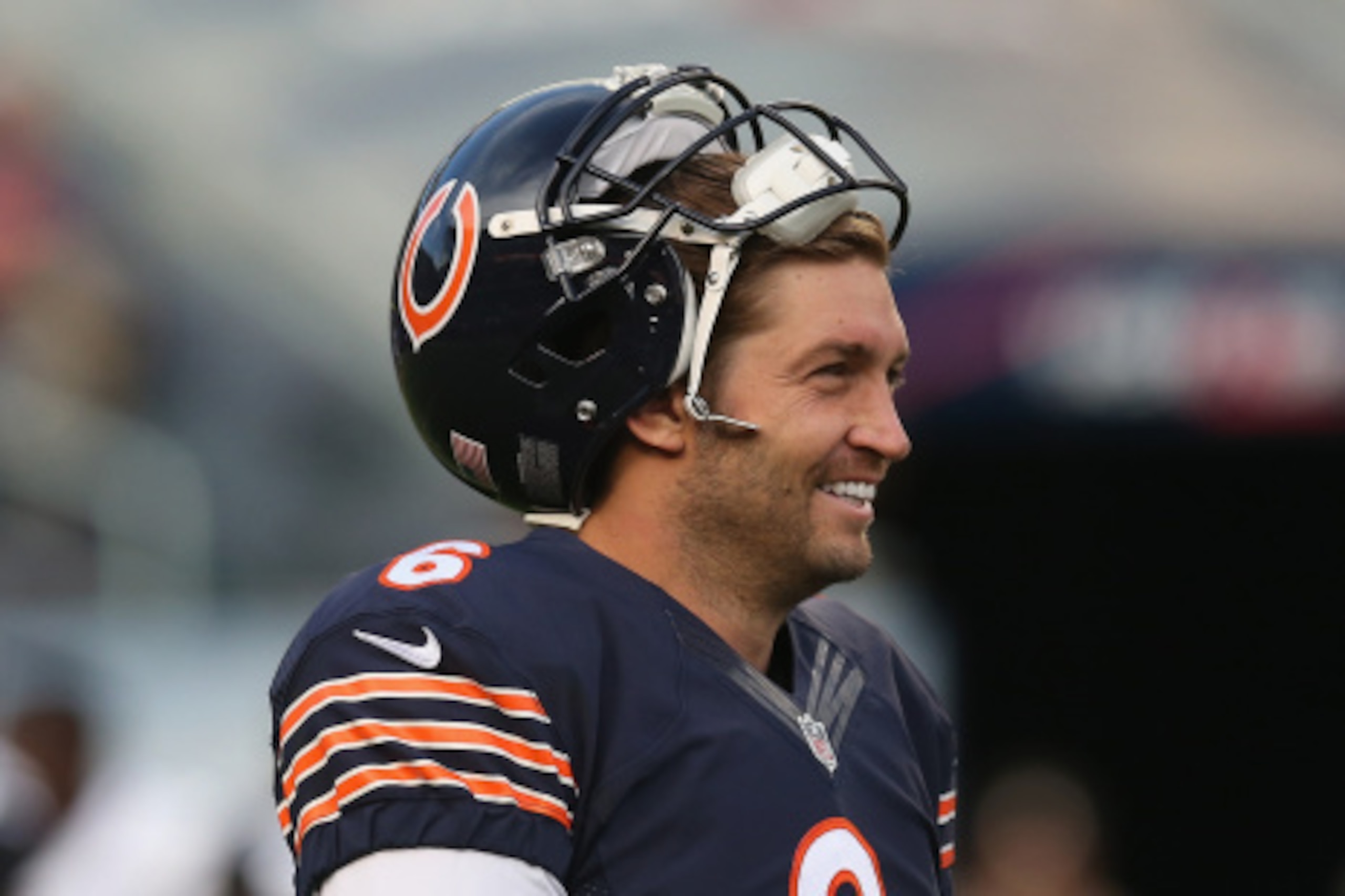 CHICAGO, IL - AUGUST 14:  Jay Cutler #6 of the Chicago Bears smiles during warm-ups before a preseason game against the Jacksonville Jaguars at Soldier Field on August 14, 2014 in Chicago, Illinois.  The Bears defeated the Jaguars 20-19.  (Photo by Jonath