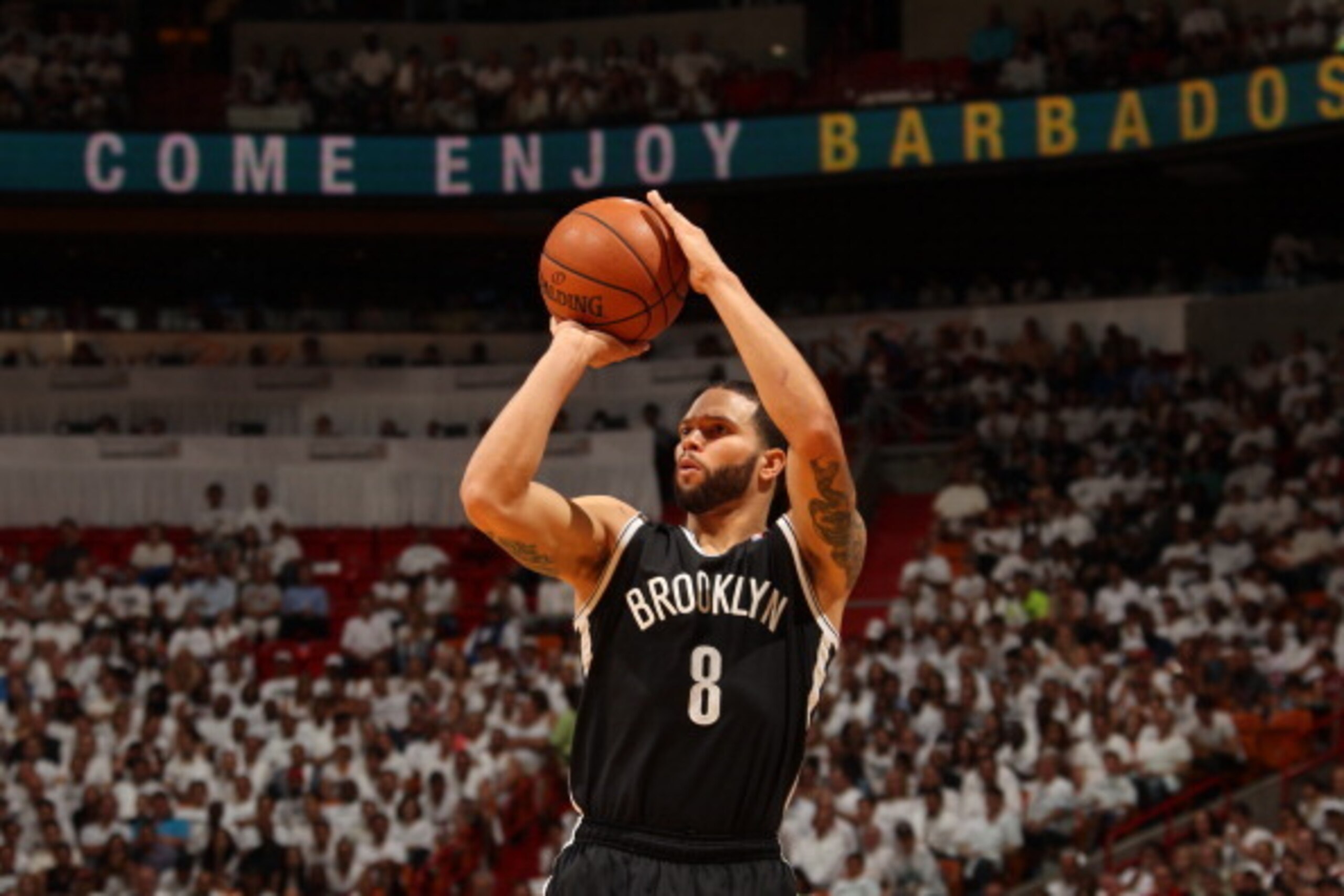 MIAMI, FL - MAY 6: Deron Williams #8 of the Brooklyn Nets shoots against the Miami Heat in Game One of the Eastern Conference Semi-Finals during the 2014 NBA Playoffs at American Airlines Arena on May 6, 2014 in Miami, Florida. NOTE TO USER: User expressl