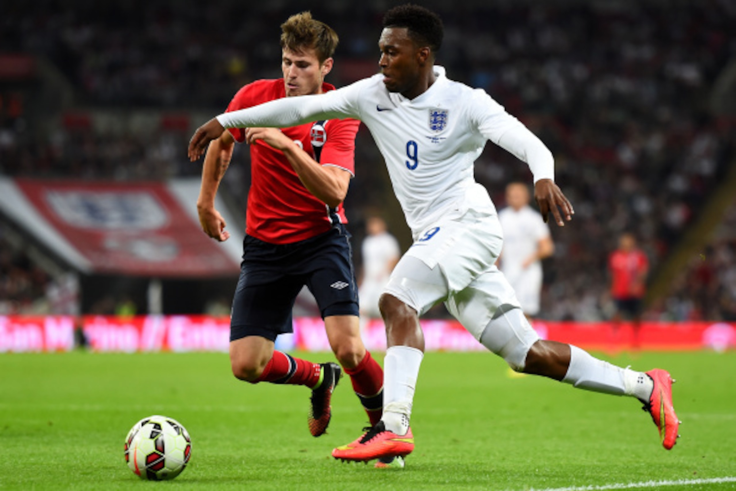 LONDON, ENGLAND - SEPTEMBER 03:  Daniel Sturridge of England (R) runs past Havard Nordtveit of Norway during the International friendly match between England and Norway at Wembley Stadium on September 3, 2014 in London, England.  (Photo by Laurence Griffi