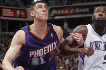 SACRAMENTO, CA - APRIL 16: Alex Len #21 of the Phoenix Suns battles Quincy Acy #5 of the Sacramento Kings on April16, 2014 at Sleep Train Arena in Sacramento, California. NOTE TO USER: User expressly acknowledges and agrees that, by downloading and or usi