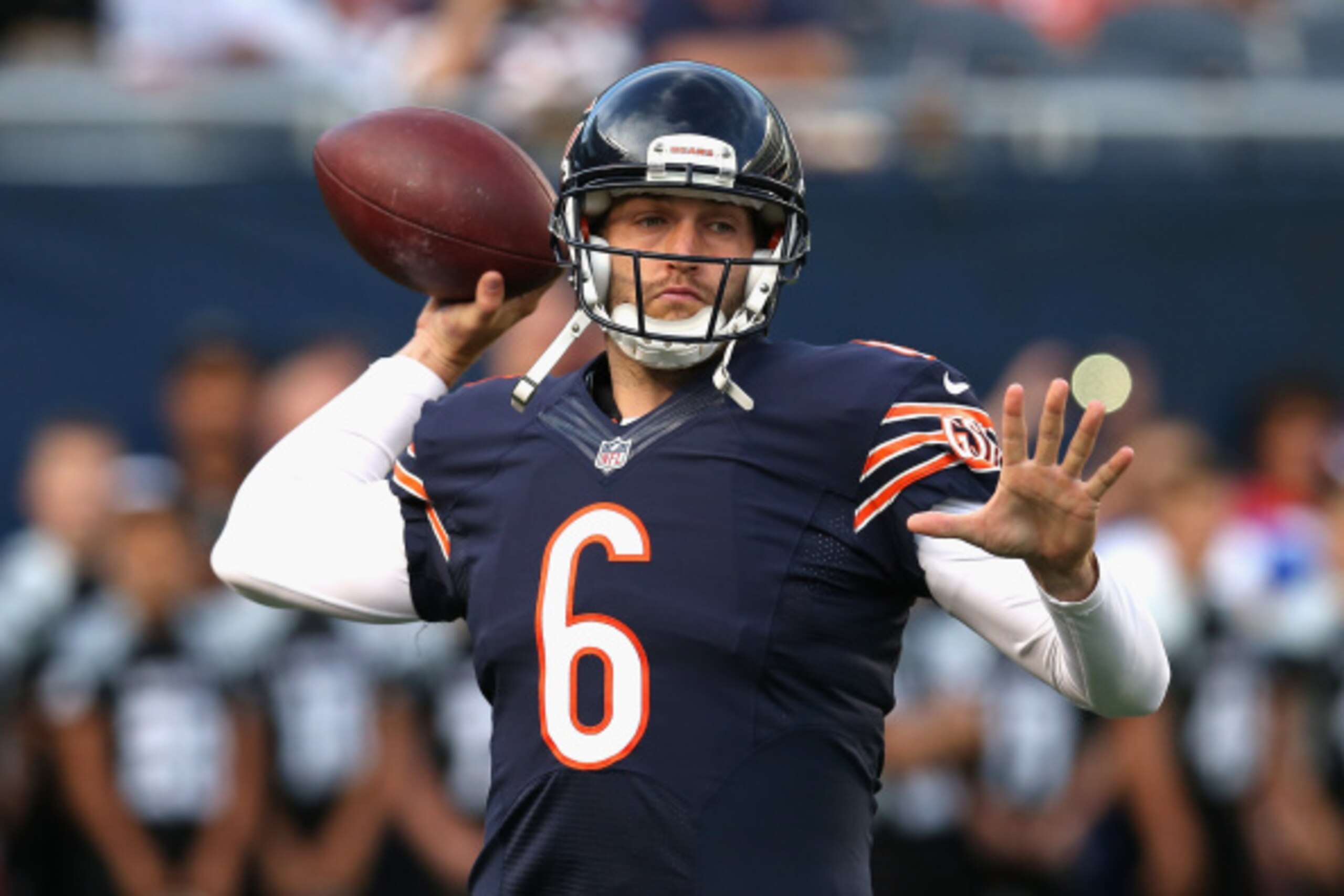 CHICAGO, IL - AUGUST 14:  Jay Cutler #6 of the Chicago Bears participates in warm-ups before a preseason game against the Jacksonville Jaguars at Soldier Field on August 14, 2014 in Chicago, Illinois.  The Bears defeated the Jaguars 20-19.  (Photo by Jona