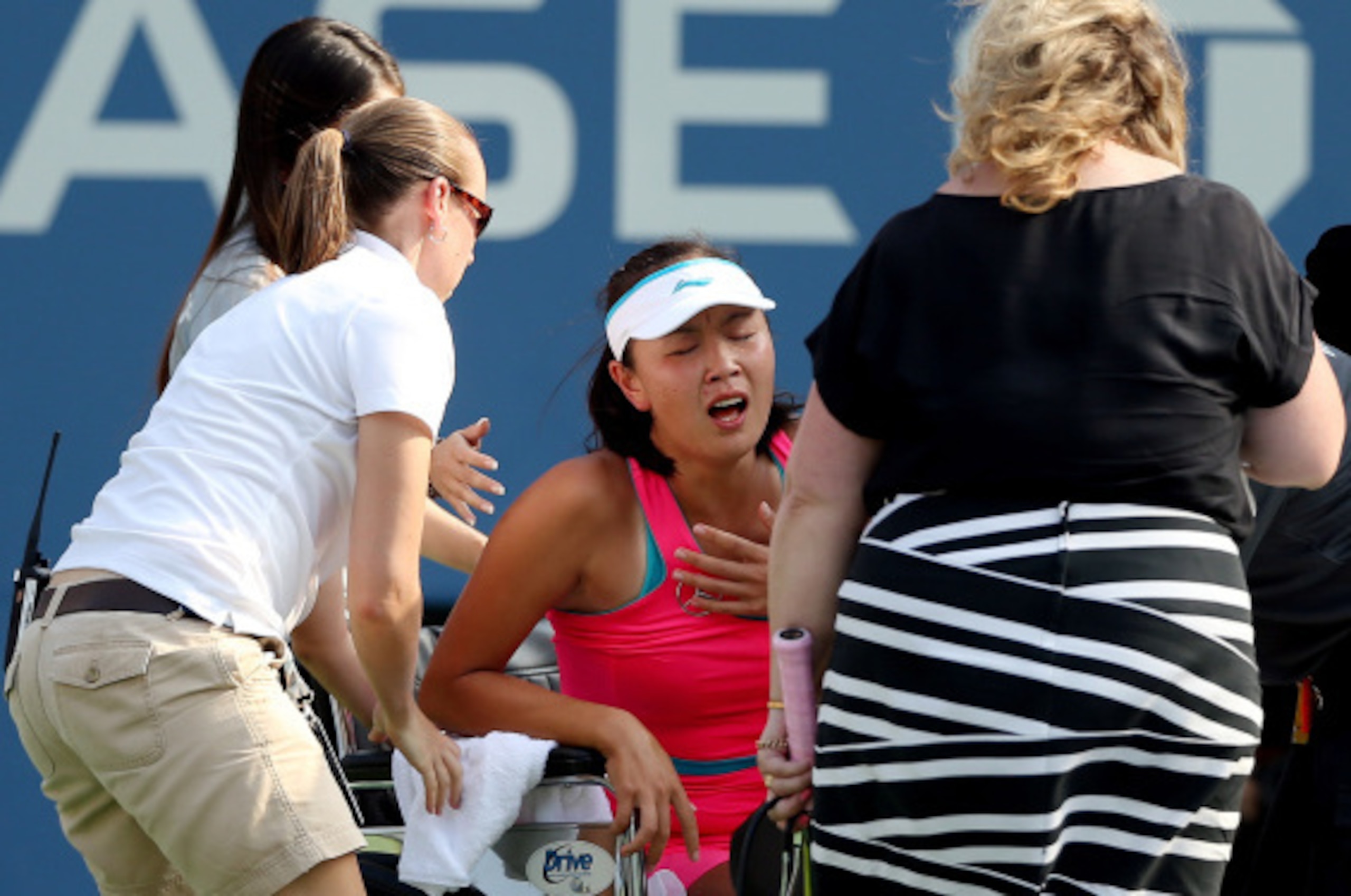 NEW YORK, NY - SEPTEMBER 05:  Shuai Peng of China reacts after getting injured during her women's singles semifinal match against Caroline Wozniacki of Denmark on Day Twelve of the 2014 US Open at the USTA Billie Jean King National Tennis Center on Septem