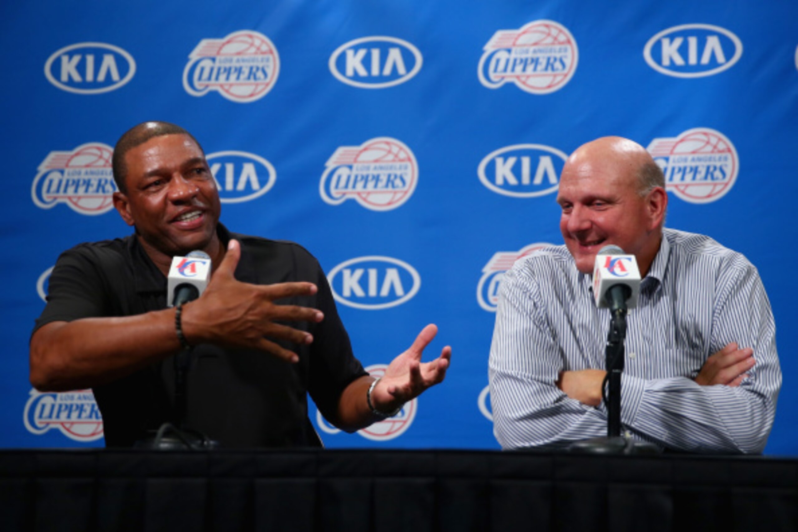 LOS ANGELES, CA - AUGUST 18:  Los Angeles Clippers head coach Doc Rivers and new owner of the Clippers Steve Ballmer address the media after Ballmer was introduced for the first time during Los Angeles Clippers Fan Festival at Staples Center on August 18,