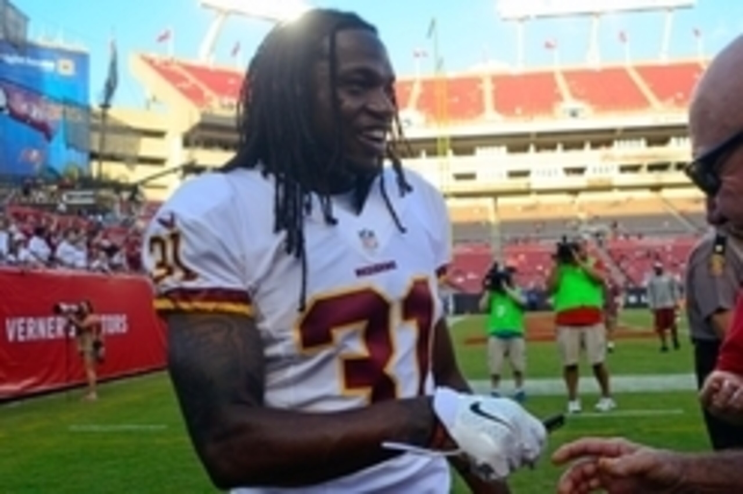 Aug 28, 2014; Tampa, FL, USA; Washington Redskins strong safety Brandon Meriweather (31) signs autographs pre game before the Redskins beat the Tampa Bay Buccaneers 24-10 at Raymond James Stadium. Mandatory Credit: David Manning-USA TODAY Sports