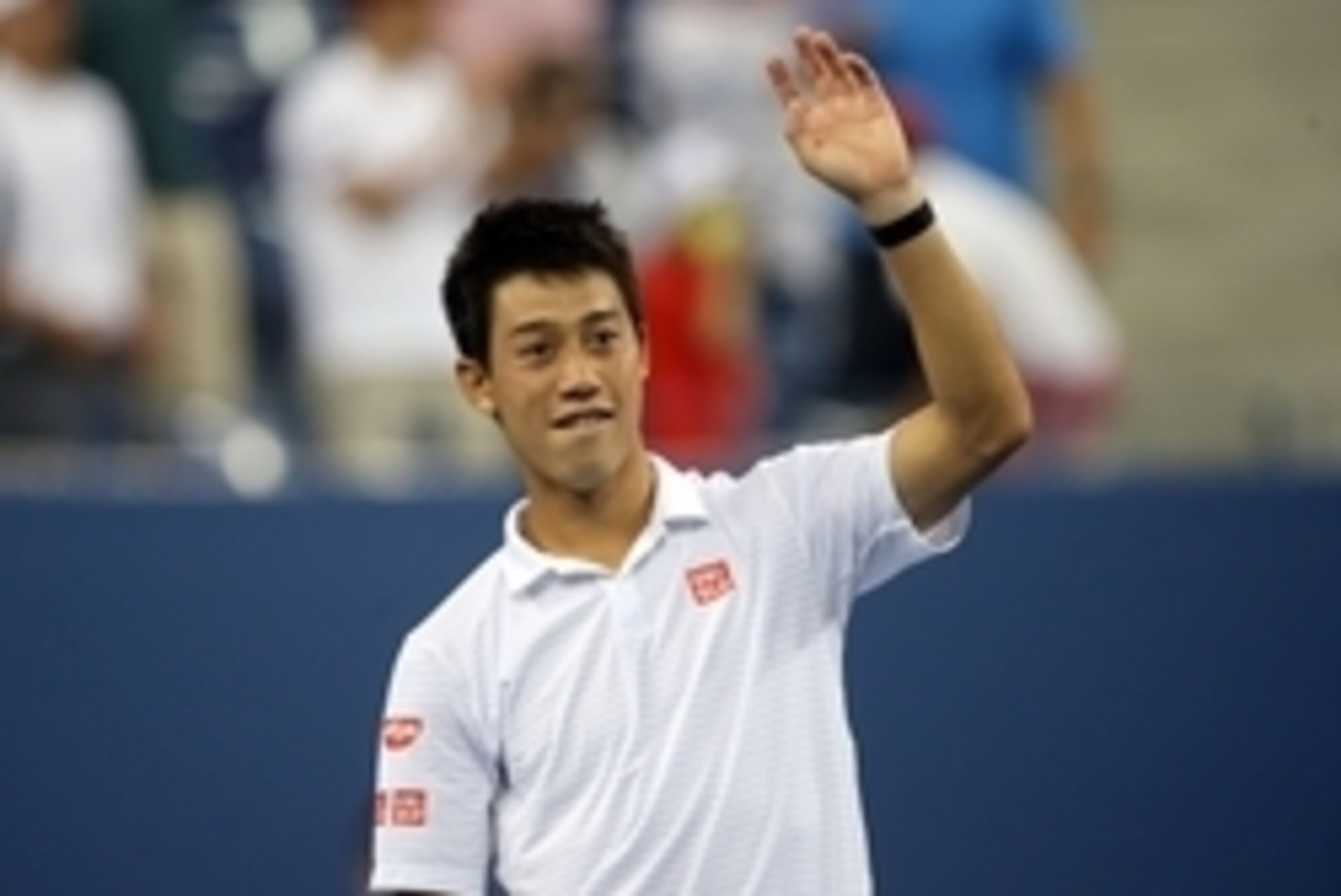Sep 3, 2014; New York, NY, USA; Kei Nishikori (JPN) waves to the crowd after recording match point against Stanislas Wawrinka (SUI) on day ten of the 2014 U.S. Open tennis tournament at USTA Billie Jean King National Tennis Center. Mandatory Credit: Jerry