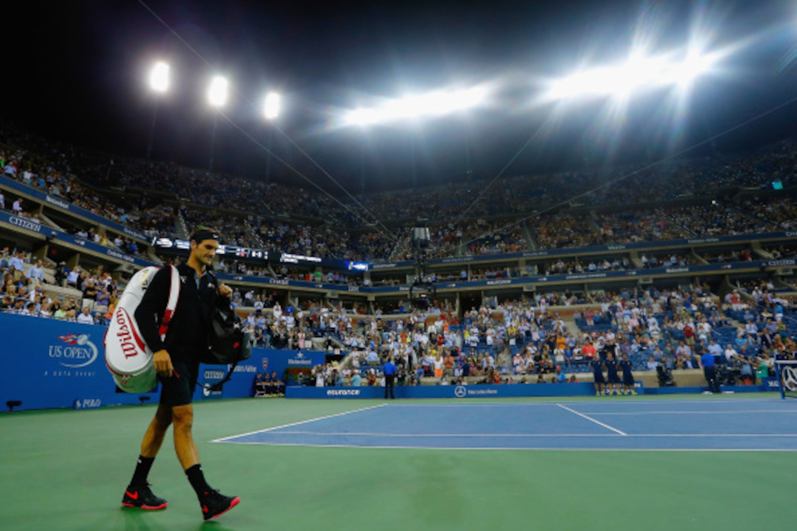 NEW YORK, NY - SEPTEMBER 04: Roger Federer of Switzerland walks on to the court prior to his match against Gael Monfils of France in their men's singles quarterfinal match on Day Eleven of the 2014 US Open at the USTA Billie Jean King National Tennis Cent