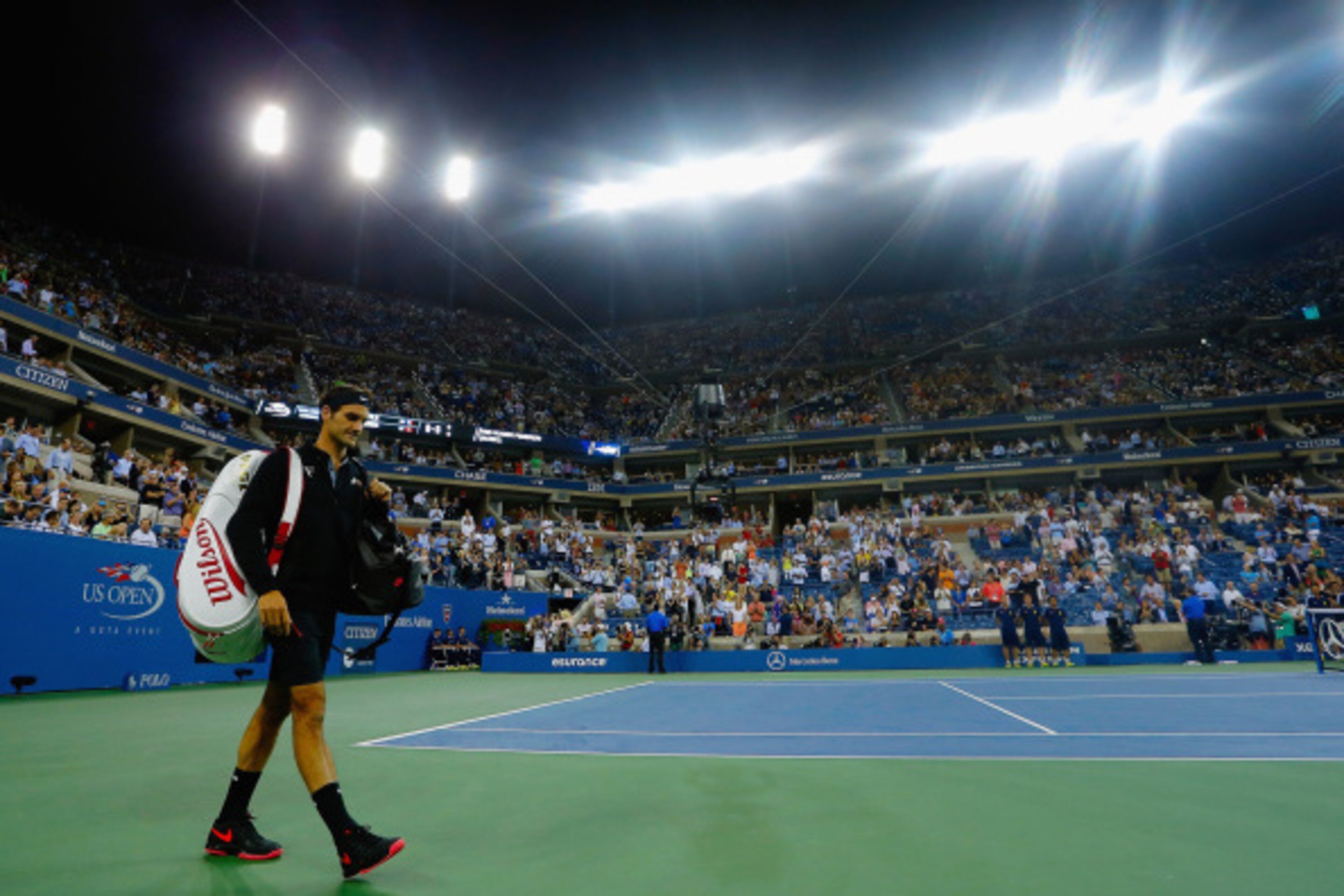 NEW YORK, NY - SEPTEMBER 04: Roger Federer of Switzerland walks on to the court prior to his match against Gael Monfils of France in their men's singles quarterfinal match on Day Eleven of the 2014 US Open at the USTA Billie Jean King National Tennis Cent