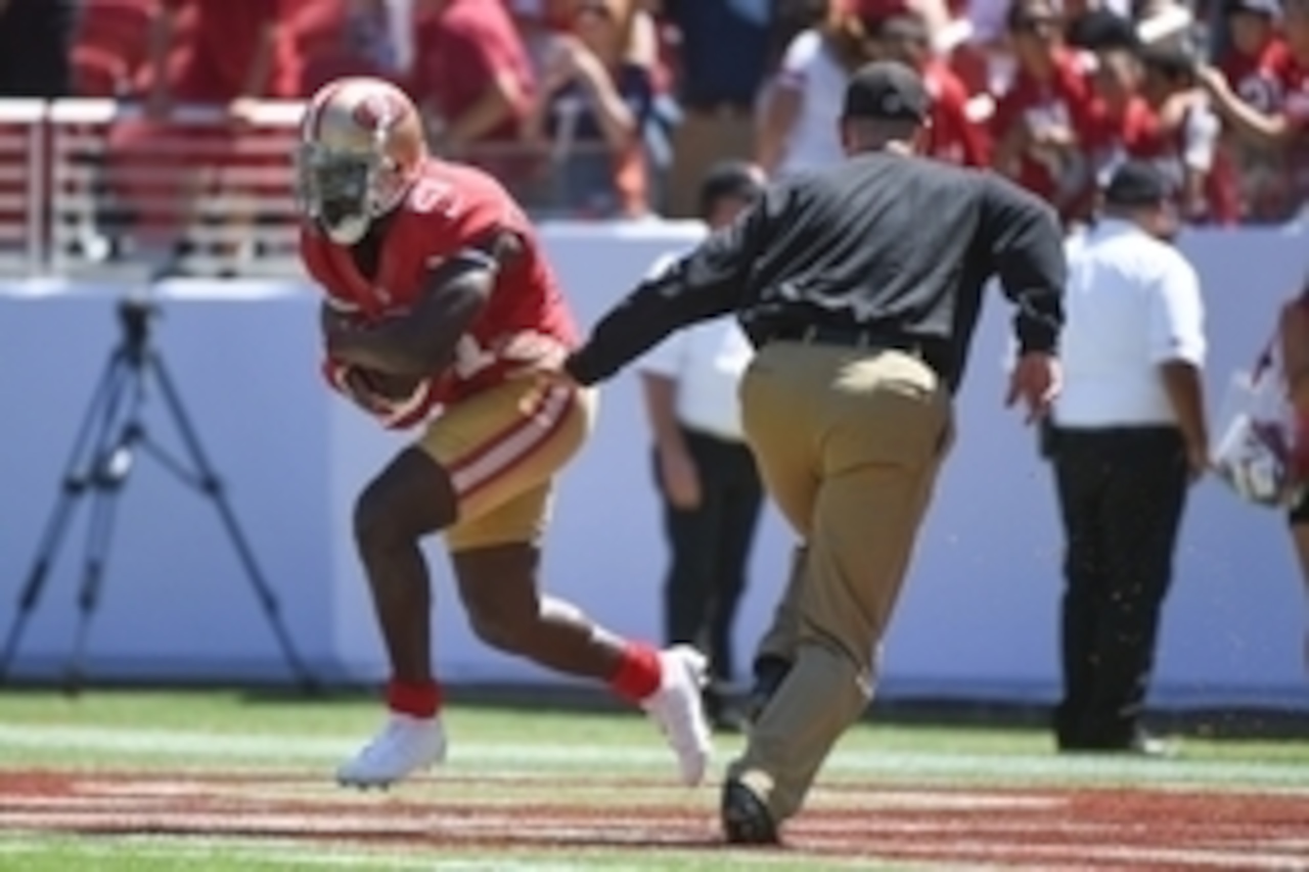 August 17, 2014; Santa Clara, CA, USA; San Francisco 49ers running back Frank Gore (21) receives the hand off from head coach Jim Harbaugh (right) before the game against the Denver Broncos at Levi's Stadium. Mandatory Credit: Kyle Terada-USA TODAY Sports
