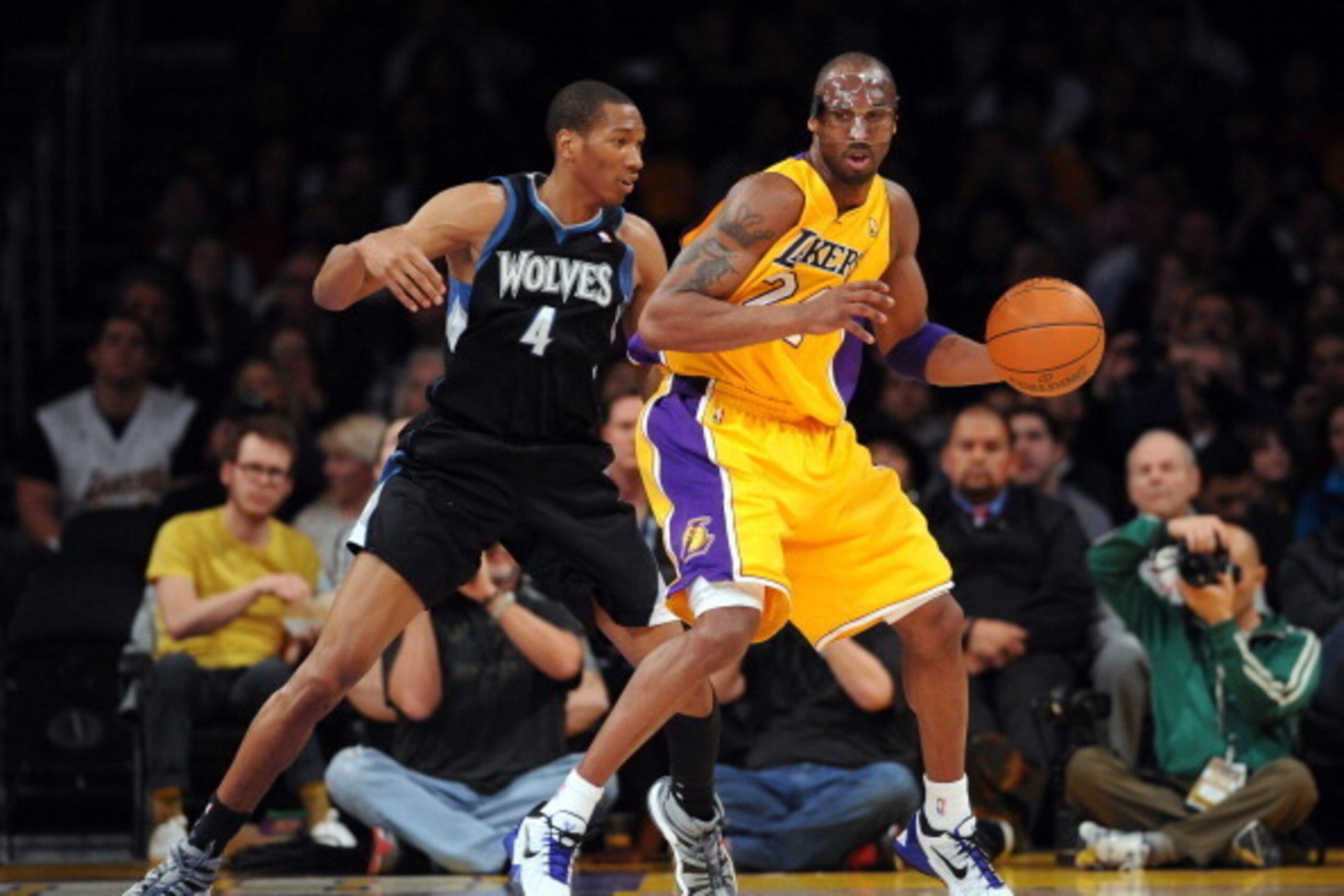 LOS ANGELES, CA - FEBRUARY 29: Kobe Bryant #24 of the Los Angeles Lakers protects the ball from Wesley Johnson #4 of the Minnesota Timberwolves during the game between the Minnesota Timberwolves and the Los Angeles Lakers at Staples Center on February 29,