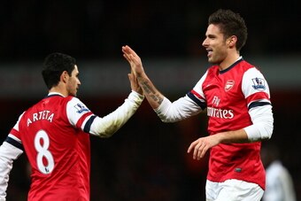 LONDON, ENGLAND - DECEMBER 29:  Olivier Giroud of Arsenal celebrates scoring their fifth goal with Mikel Arteta of Arsenal during the Barclays Premier League match between Arsenal and Newcastle United at the Emirates Stadium on December 29, 2012 in London