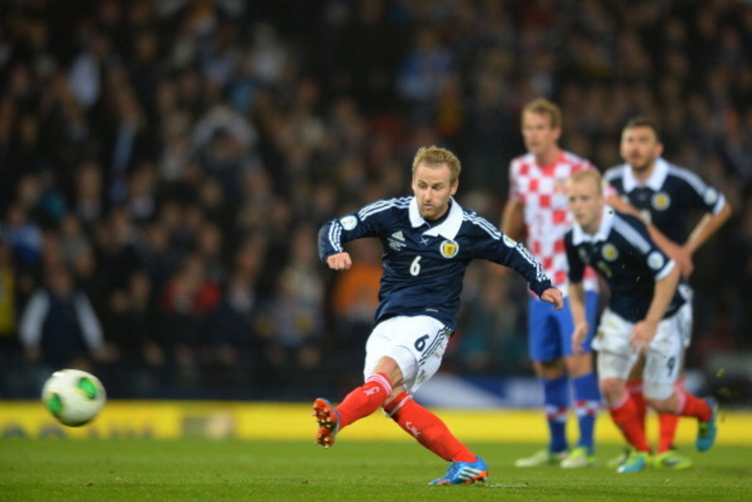 GLASGOW,  SCOTLAND - OCTOBER 15 : Barry Bannan of Scotland takes and misses a penalty during the FIFA 2014 World Cup Qualifying Group A match between Scotland and Croatia at Hampden Park on October 15, 2013.  (Photo by Mark Runnacles/Getty Images)