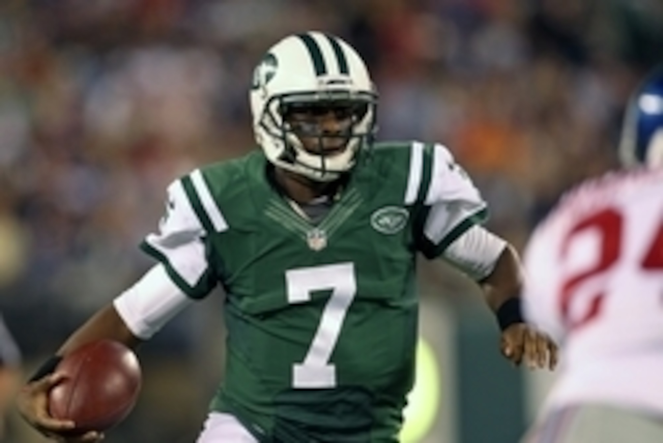 Aug 22, 2014; East Rutherford, NJ, USA; New York Jets quarterback Geno Smith (7) scrambles against the New York Giants during the second quarter at MetLife Stadium. Mandatory Credit: Adam Hunger-USA TODAY Sports