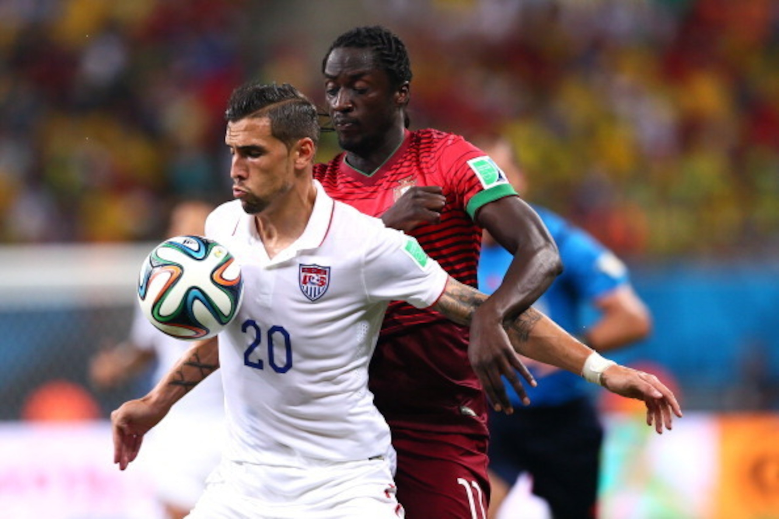 MANAUS, BRAZIL - JUNE 22:  Geoff Cameron of the United States competes for the ball against Eder of Portugal at Arena Amazonia on June 22, 2014 in Manaus, Brazil.  (Photo by Kevin C. Cox/Getty Images)