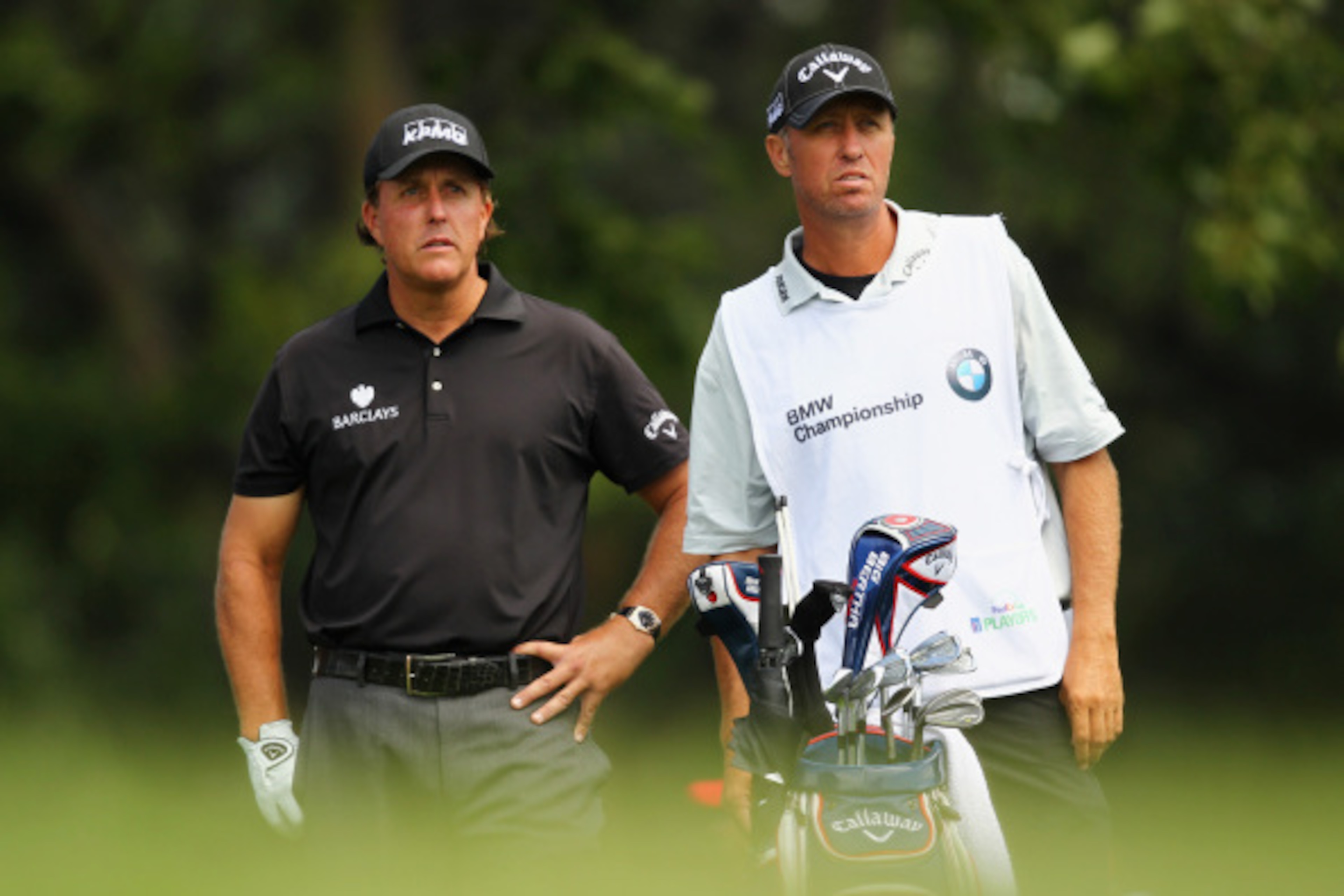 CHERRY HILLS VILLAGE, CO - SEPTEMBER 05:  Phil Mickelson of the United States stands beside caddie Jim Mackay as he prepares to hit his tee shot on the 13th hole during the second round of the BMW Championship at the Cherry Hills Country Club on September