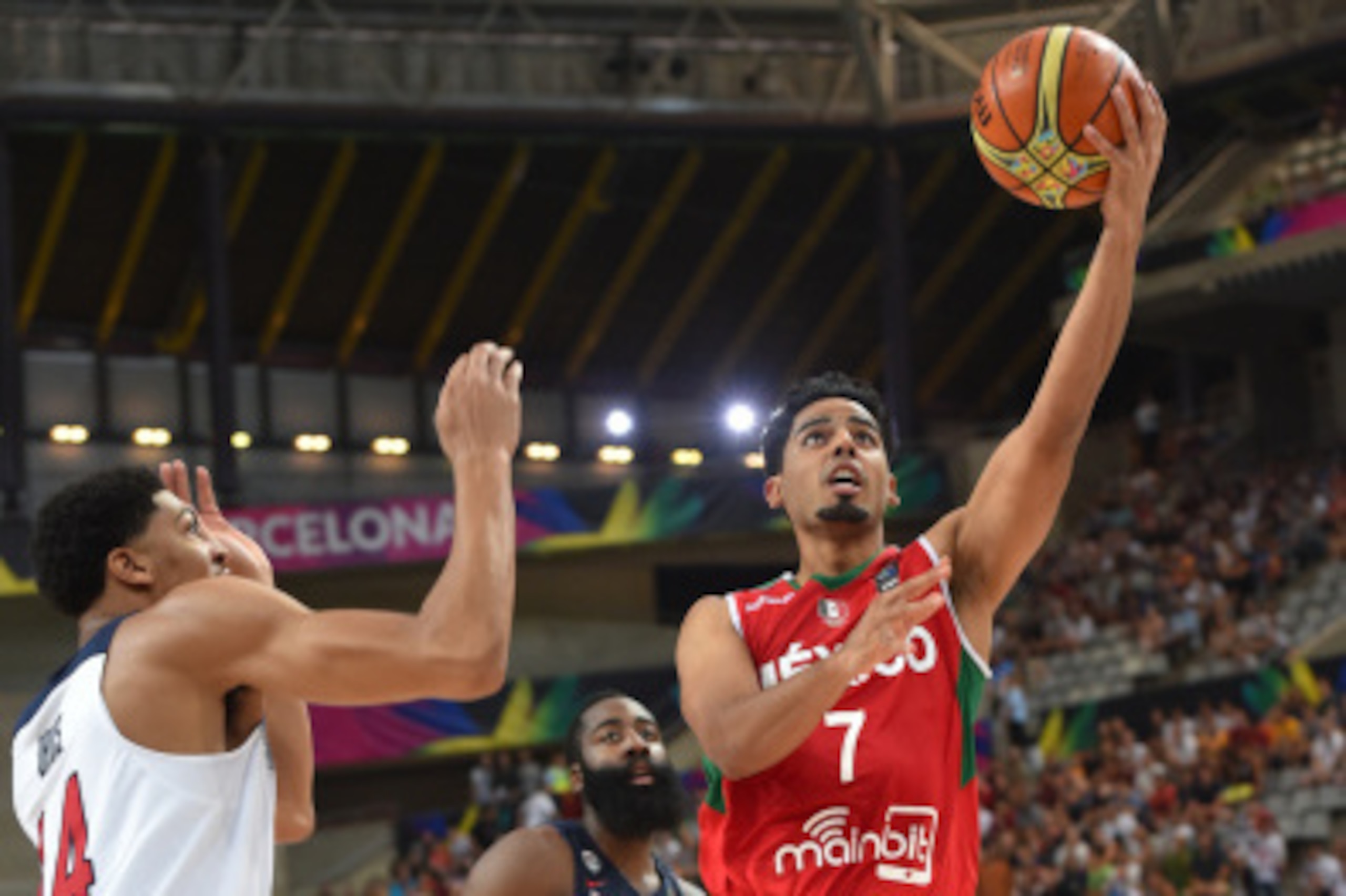 BARCELONA, SPAIN - SEPTEMBER 6: Jorge Gutierrez #7   of the Mexico National Team shoots against Anthony Davis #14 of the USA Basketball Men's National Team at Palau Sant Jordi on September 6, 2014 in Barcelona, Spain.  NOTE TO USER: User expressly acknowl