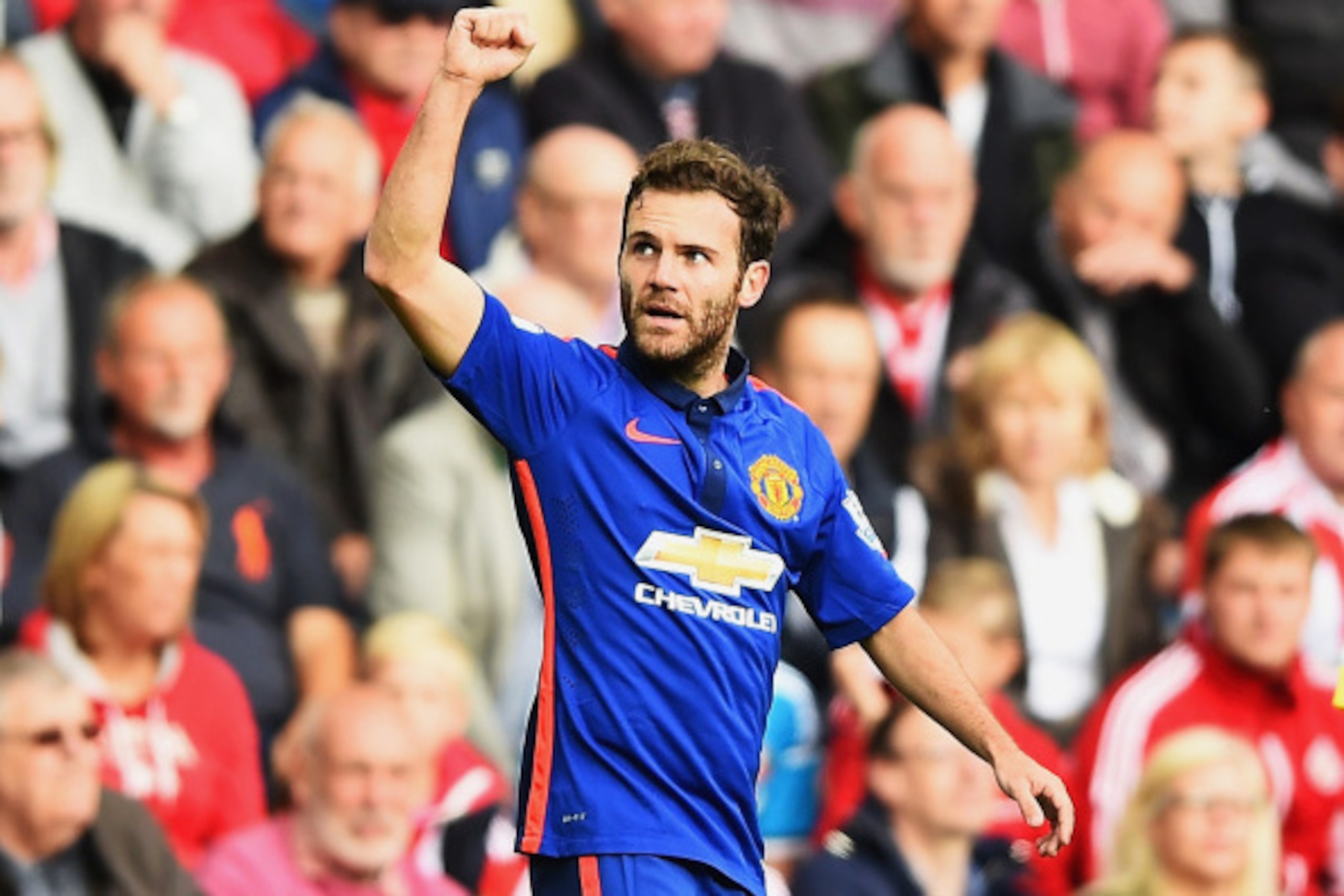 SUNDERLAND, ENGLAND - AUGUST 24: Juan Mata of Manchester United celebrates scoring the opening goal during the Barclays Premier League match between Sunderland and Manchester United at Stadium of Light on August 24, 2014 in Sunderland, England.  (Photo by