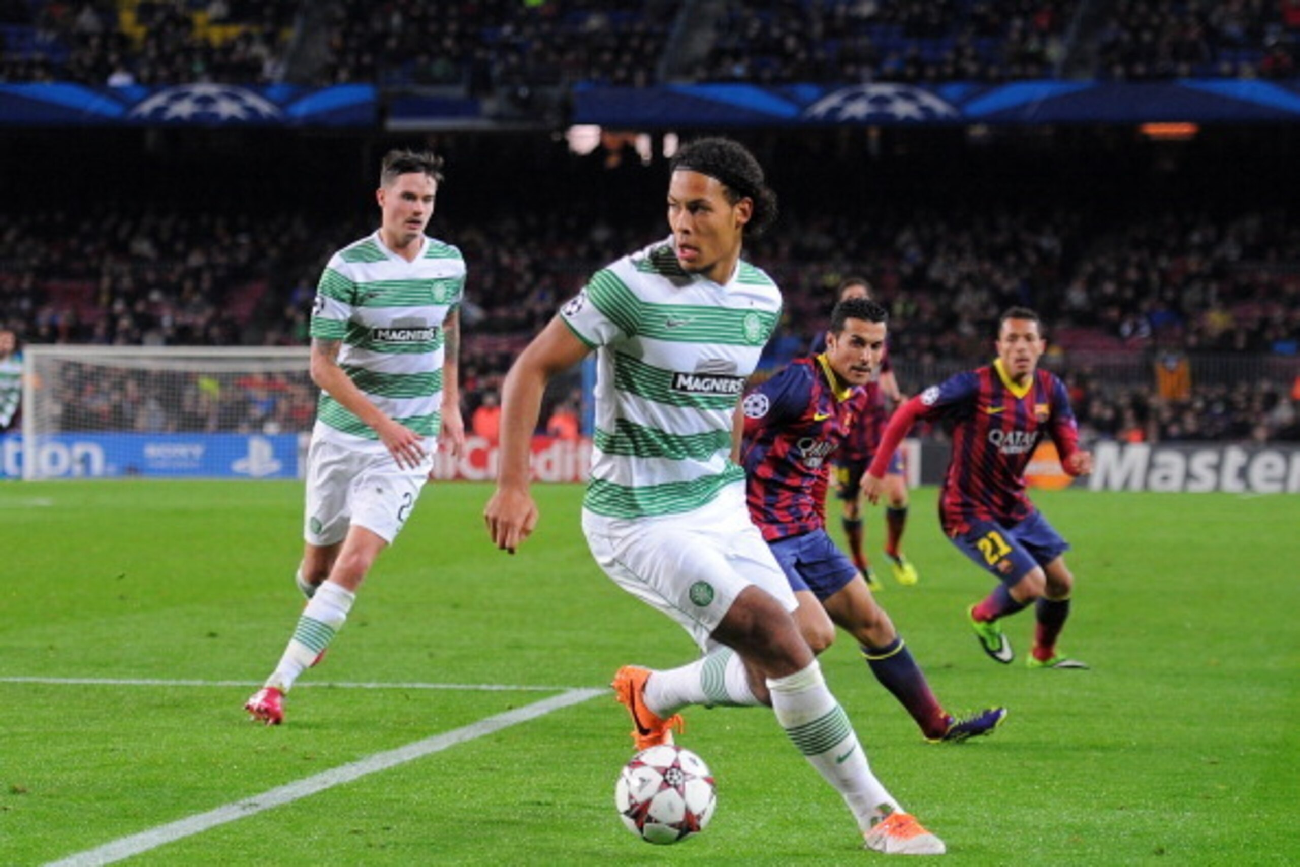 BARCELONA, SPAIN - DECEMBER 11: Virgil van Dijk of Celtic FC in action during the UEFA Champions League, Group H match between FC Barcelona and Celtic FC at the Camp Nou Stadium on December 11, 2013 in Barcelona, Spain.  (Photo by Denis Doyle/Getty Images
