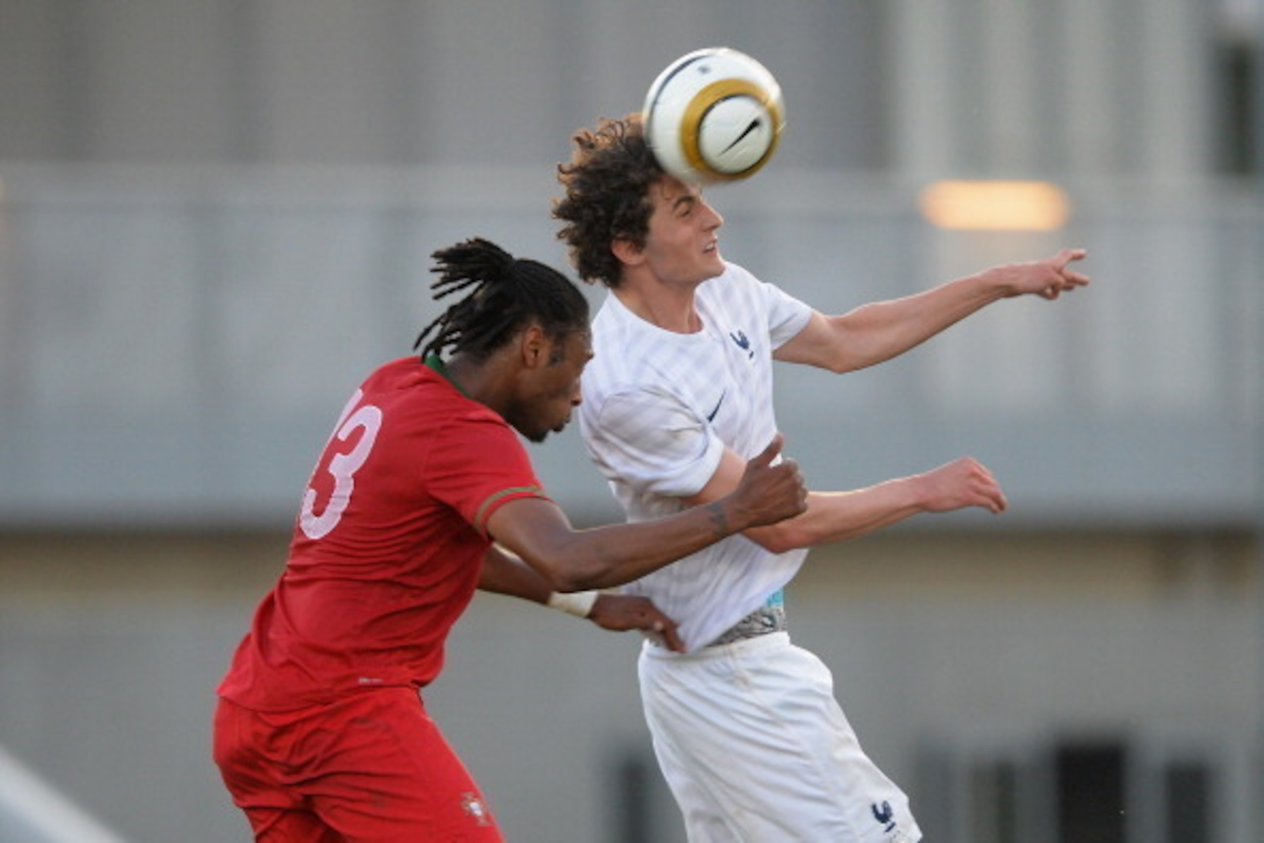 TOULON, FRANCE - MAY 29:  Adrien Rabiot of France jumps with Ruben Semedo of Portugal for the ball during the Toulon Tournament Group A match between France v Portugal at the Leo Legrange Stadium on May 29, 2014 in Toulon, France.  (Photo by Christopher L
