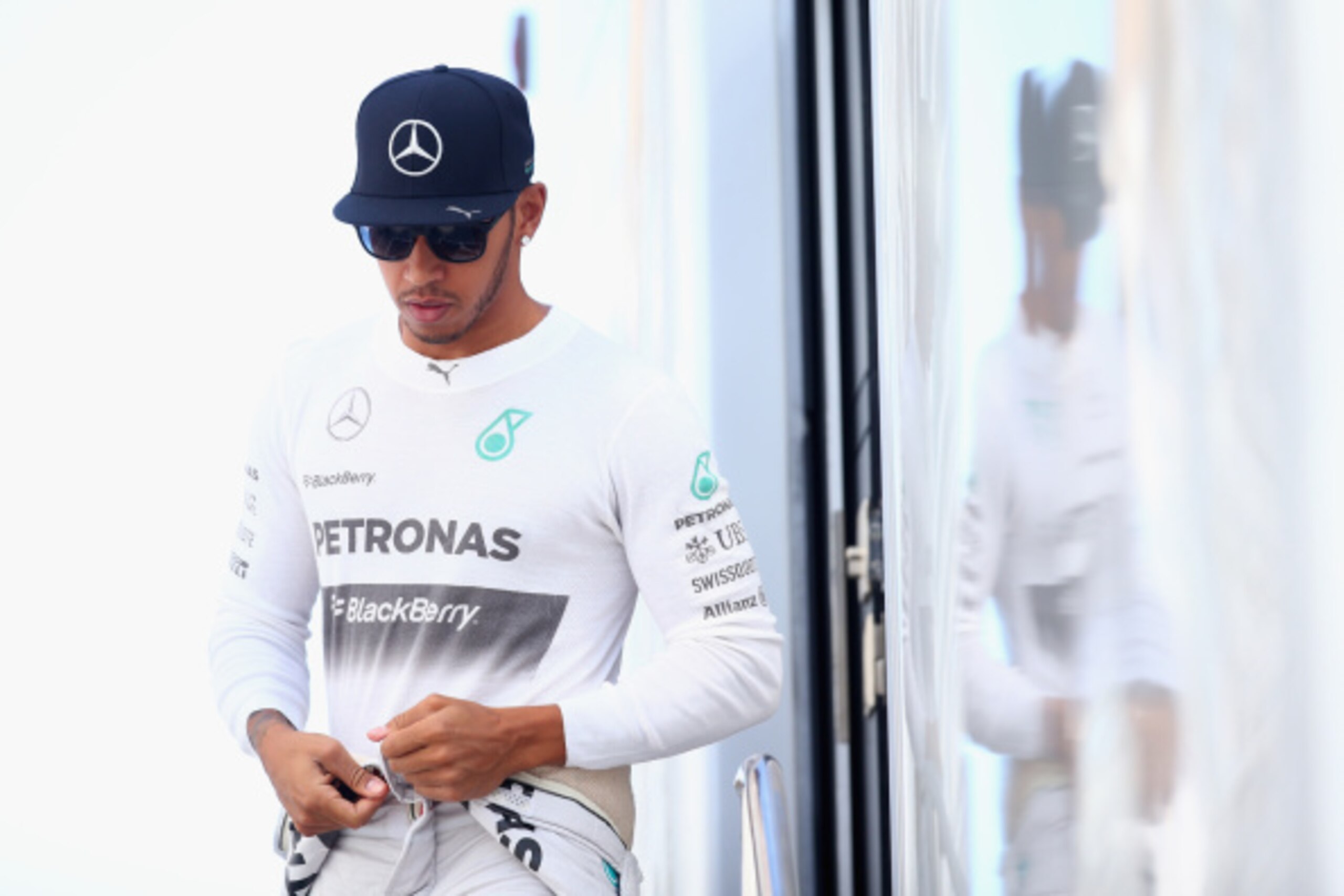 MONZA, ITALY - SEPTEMBER 06:  Lewis Hamilton of Great Britain and Mercedes GP leaves his motorhome during Practice ahead of the F1 Grand Prix of Italy at Autodromo di Monza on September 6, 2014 in Monza, Italy.  (Photo by Paul Gilham/Getty Images)