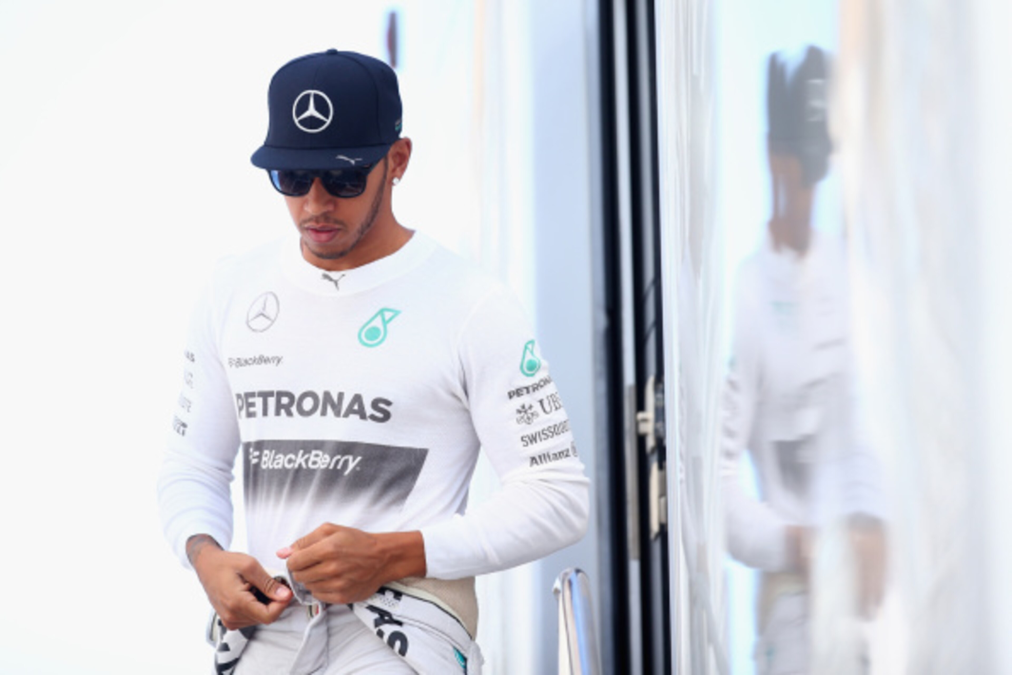 MONZA, ITALY - SEPTEMBER 06:  Lewis Hamilton of Great Britain and Mercedes GP leaves his motorhome during Practice ahead of the F1 Grand Prix of Italy at Autodromo di Monza on September 6, 2014 in Monza, Italy.  (Photo by Paul Gilham/Getty Images)