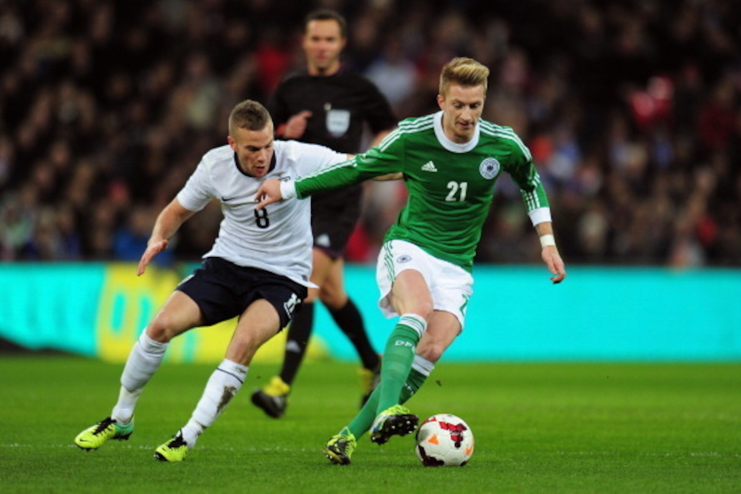 LONDON, ENGLAND - NOVEMBER 19:  Marco Reus of Germany holds off Tom Cleverley of England during the international friendly match between England and Germany at Wembley Stadium on November 19, 2013 in London, England.  (Photo by Shaun Botterill/Getty Image