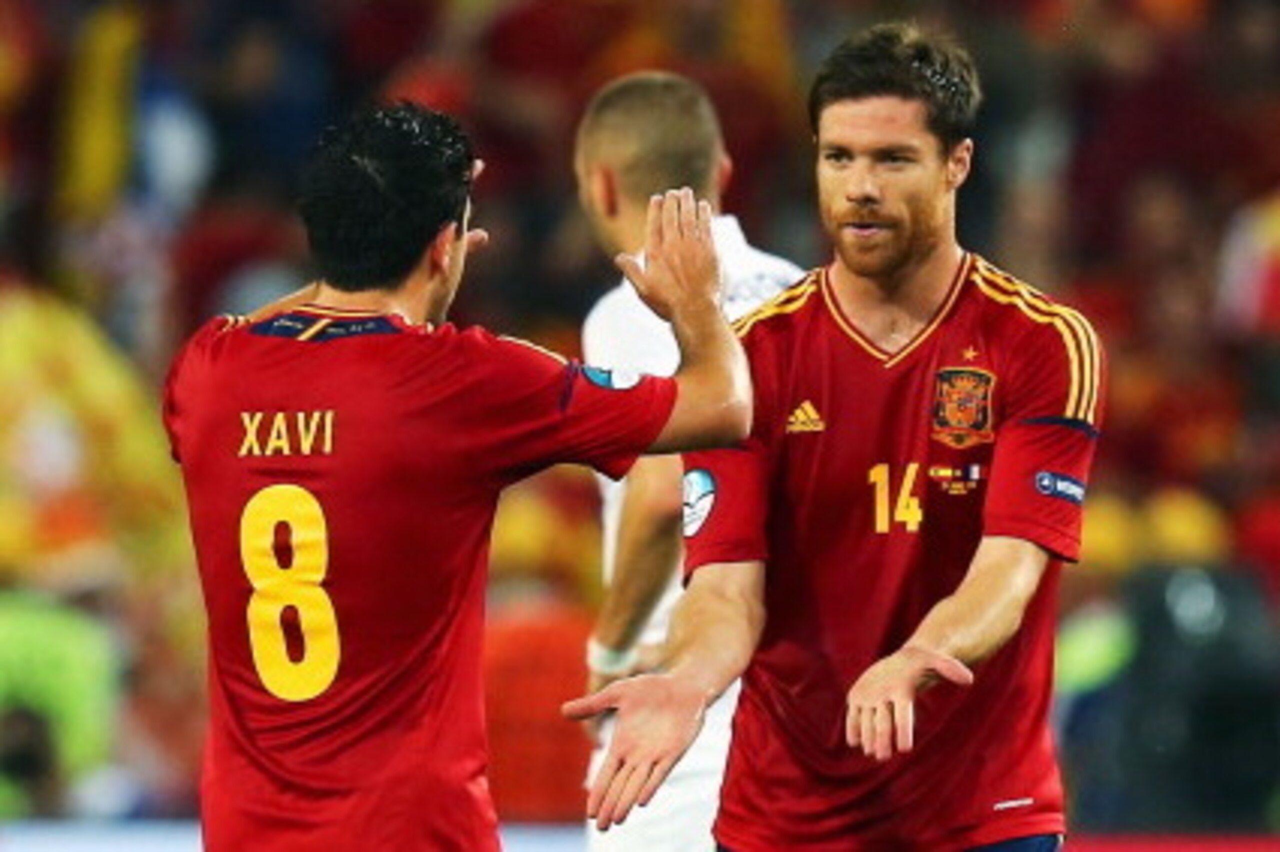 DONETSK, UKRAINE - JUNE 23:  Xabi Alonso of Spain celebrates after scoring the first goal with Xavi during the UEFA EURO 2012 quarter final match between Spain and France at Donbass Arena on June 23, 2012 in Donetsk, Ukraine.  (Photo by Martin Rose/Getty 