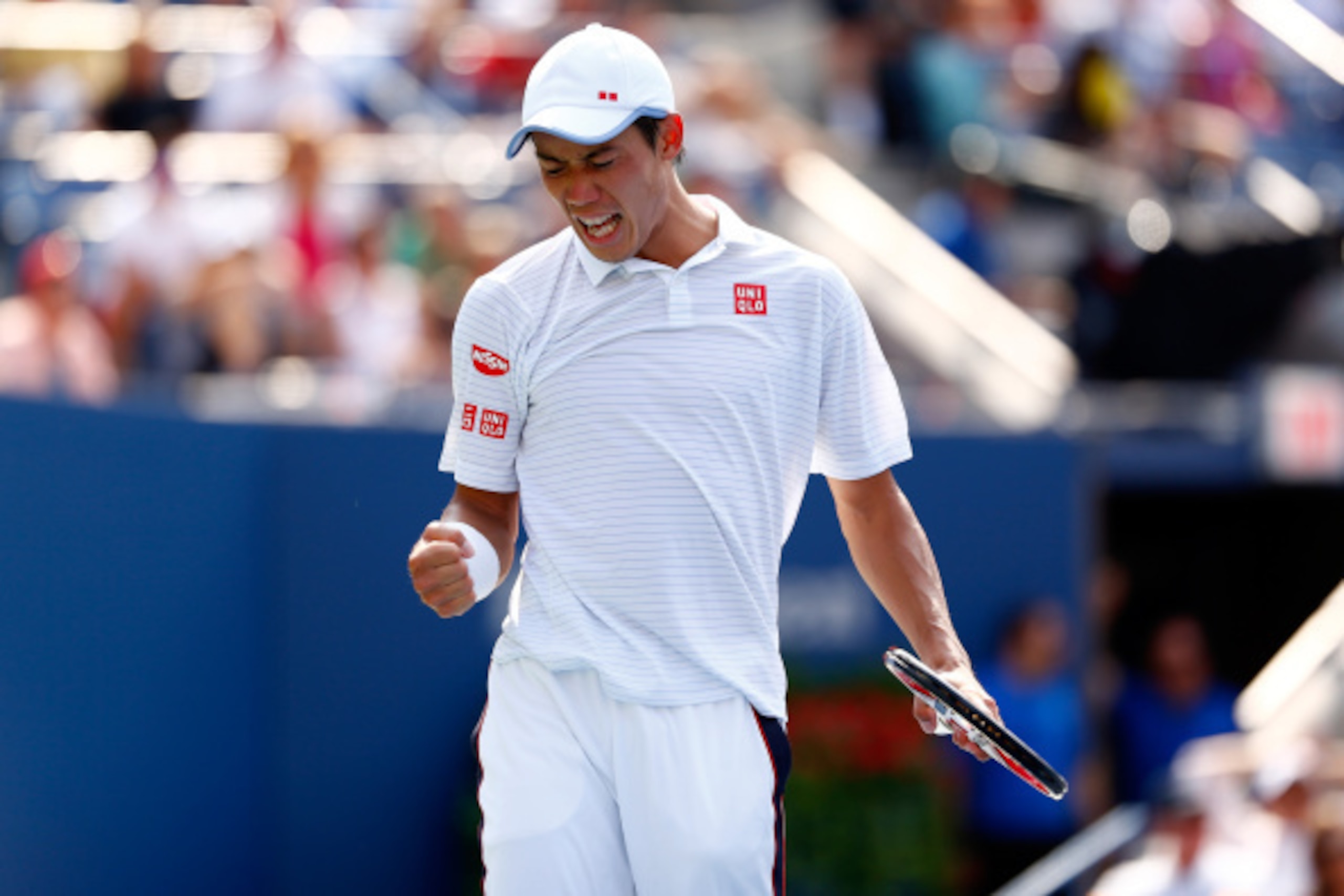 NEW YORK, NY - SEPTEMBER 06:  Kei Nishikori of Japan reacts against Novak Djokovic of Serbia during their men's singles semifinal match on Day Thirteen of the 2014 US Open at the USTA Billie Jean King National Tennis Center on September 6, 2014 in the Flu