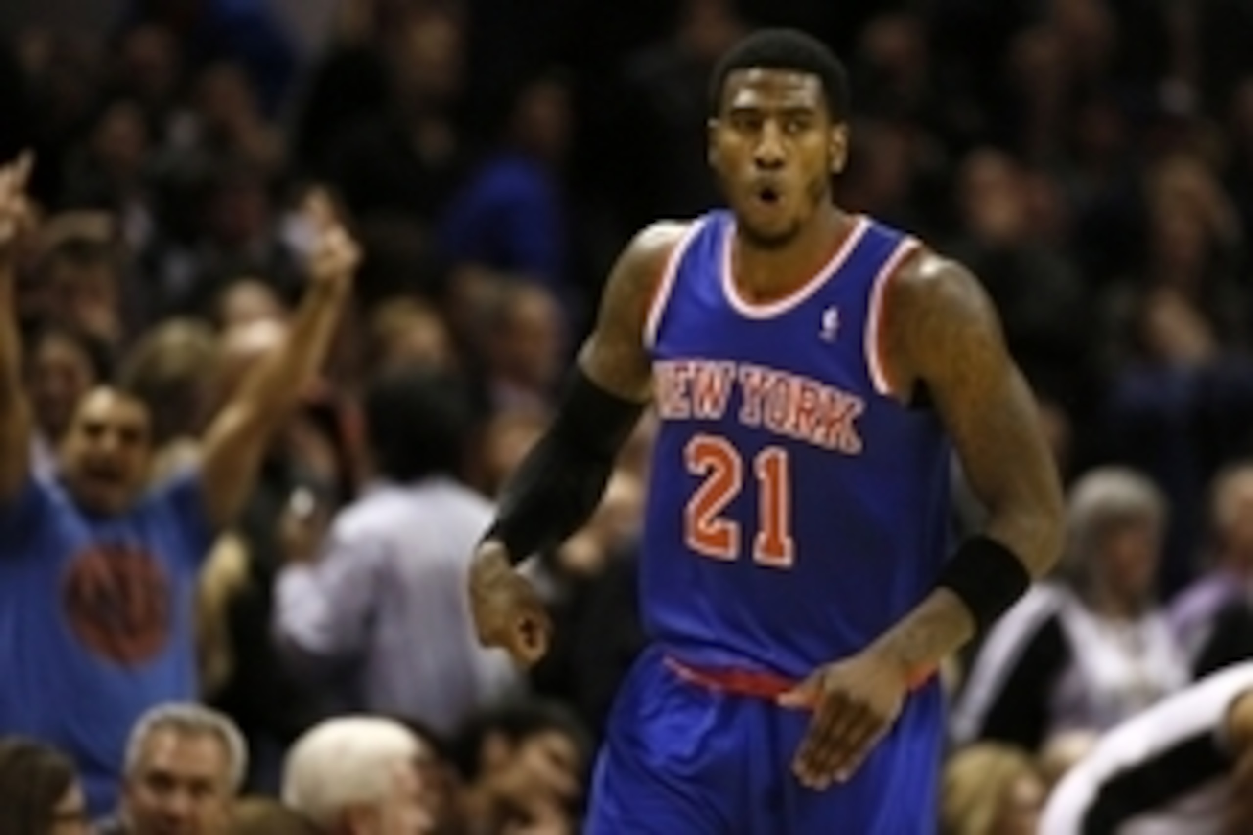Jan 2, 2014; San Antonio, TX, USA; New York Knicks guard Iman Shumpert (21) reacts after a shot during the second half against the San Antonio Spurs at AT&T Center. The Knicks won 105-101. Mandatory Credit: Soobum Im-USA TODAY Sports
