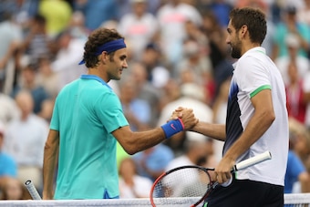 NEW YORK, NY - SEPTEMBER 06:  Roger Federer of Switzerland greets Marin Cilic (R) of Croatia after their men's singles semifinal match on Day Thirteen of the 2014 US Open at the USTA Billie Jean King National Tennis Center on September 6, 2014 in the Flus