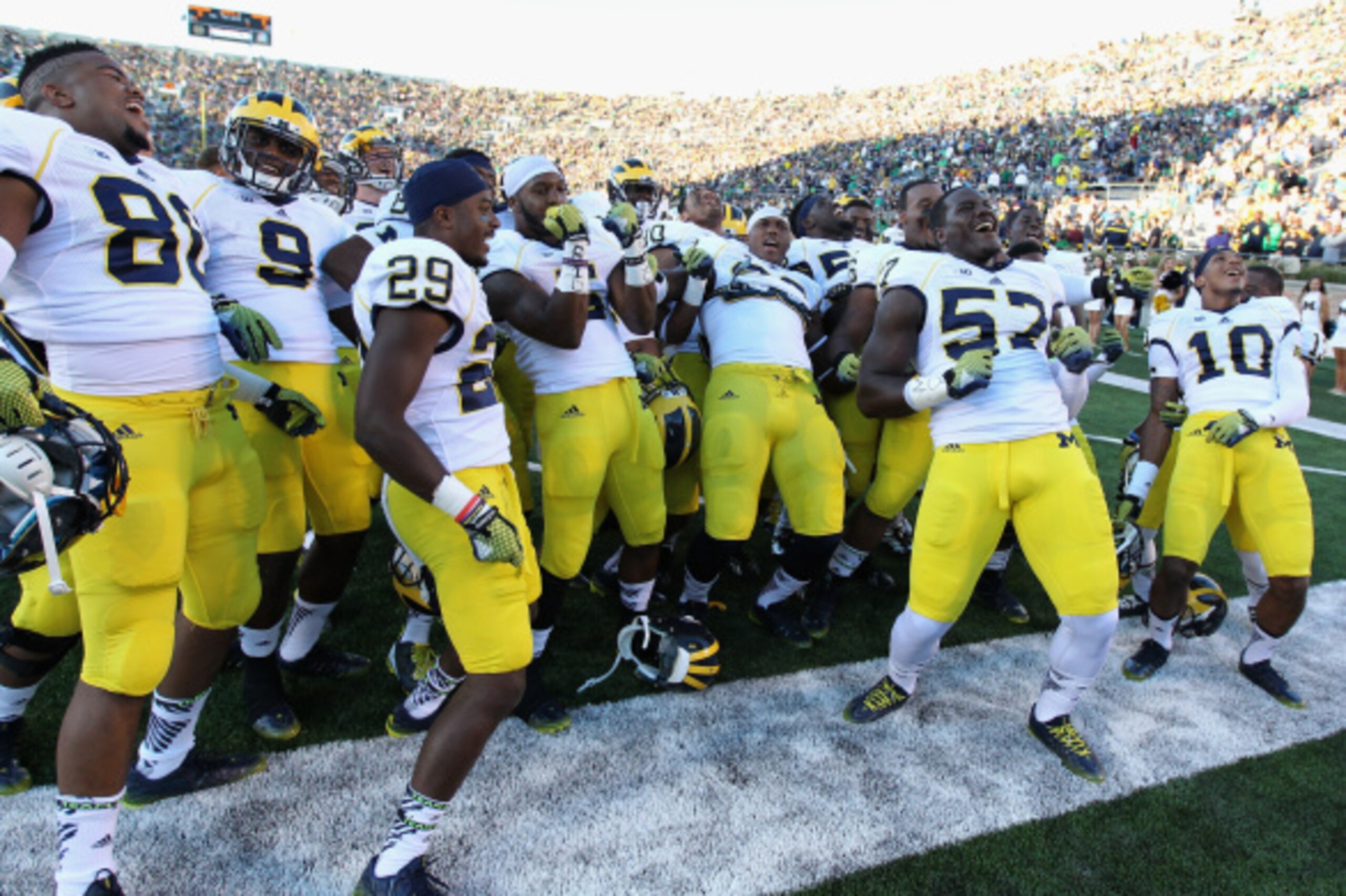 SOUTH BEND, IN - SEPTEMBER 06: Members of the Michigan Wolverine defense, lead by Frank Clark #57, do a dance after warm-ups before a game against the Notre Dame Fighting Irish at Notre Dame Stadium on September 6, 2014 in South Bend, Indiana. (Photo by J