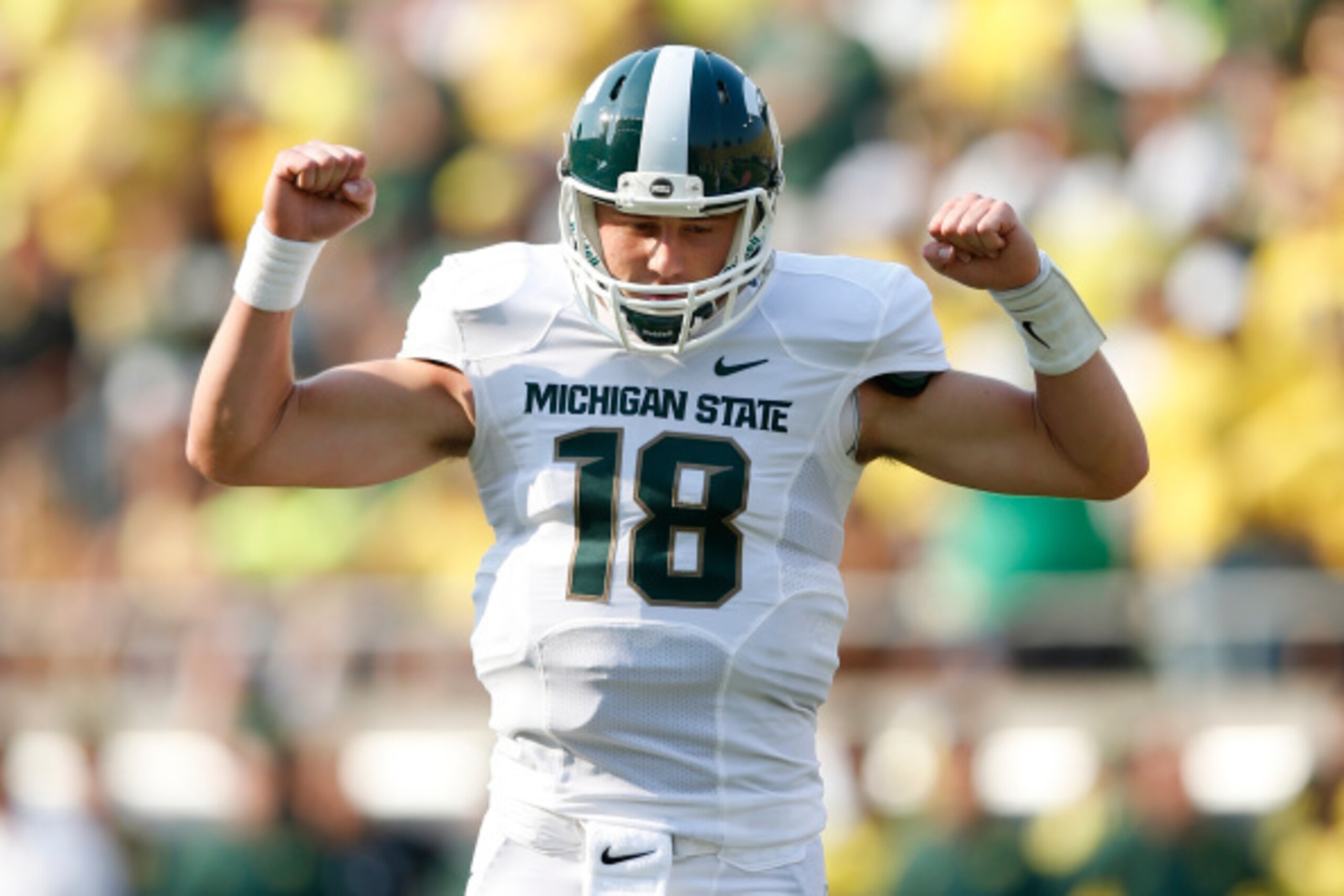 EUGENE, OR - SEPTEMBER 6: Connor Cook #18 of the Michigan State Spartans celebrates after a touchdown run by Jeremy Langford in the first half of the game against the Oregon Ducks at Autzen Stadium on September 6, 2014 in Eugene, Oregon. (Photo by Joe Rob