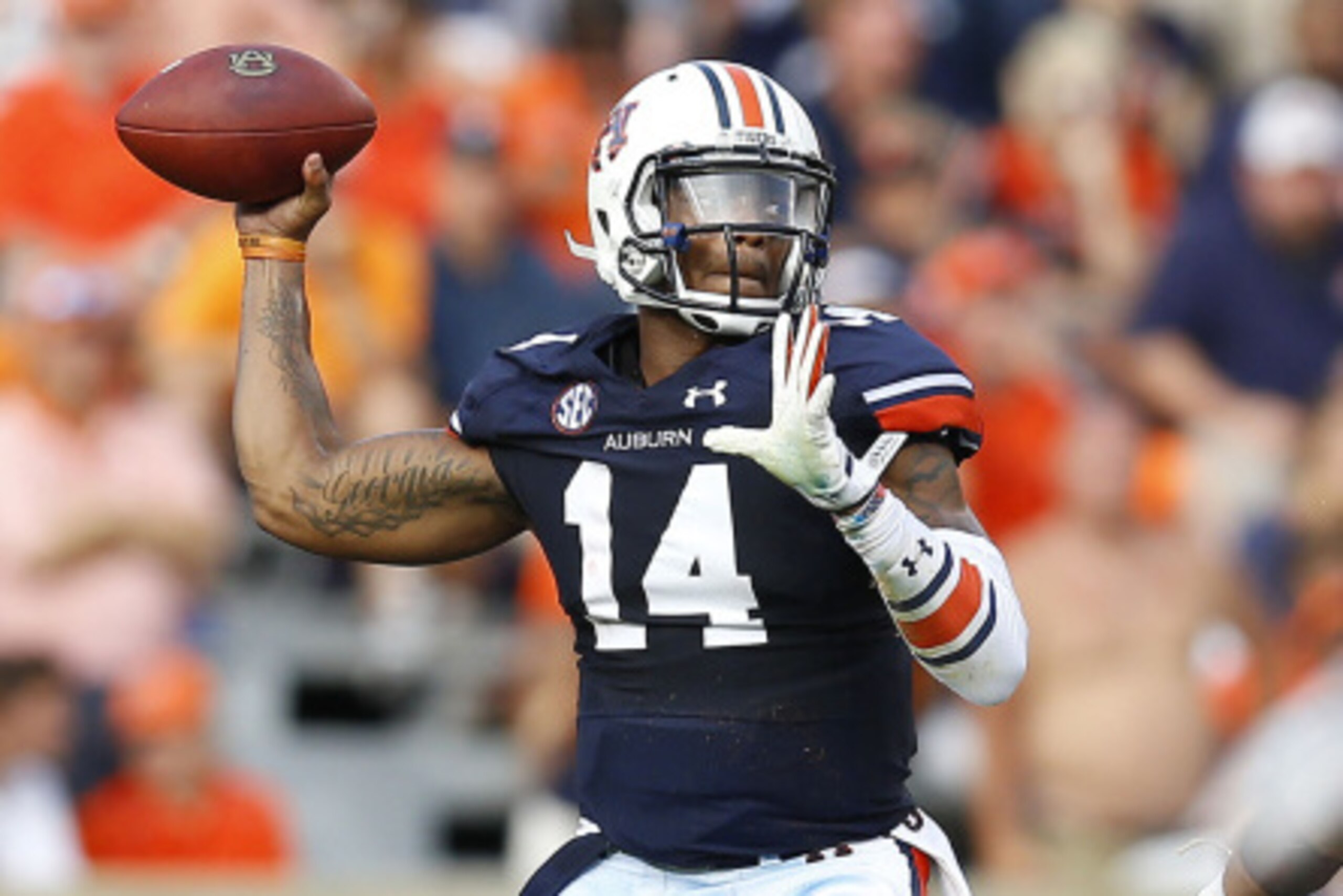 AUBURN, AL - AUGUST 30:  Quarterback Nick Marshall #14 of the Auburn Tigers throws a pass during the game against the Arkansas Razorbacks at Jordan Hare Stadium on August 30, 2014 in Auburn, Alabama.  (Photo by Mike Zarrilli/Getty Images)