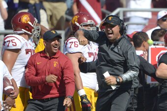Sep 6, 2014; Stanford, CA, USA; Southern California Trojans coach Steve Sarkisian celebrates in the fourth quarter against the Stanford Cardinal at Stanford Stadium. USC defeated Stanford 13-10. Mandatory Credit: Kirby Lee-USA TODAY Sports