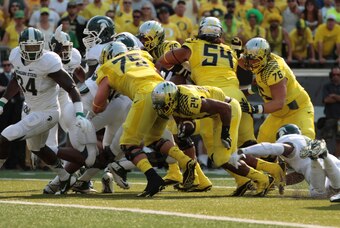 Sep 6, 2014; Eugene, OR, USA; Oregon Ducks running back Thomas Tyner (24) runs the ball in the first half against the Michigan State Spartans at Autzen Stadium. Mandatory Credit: Scott Olmos-USA TODAY Sports