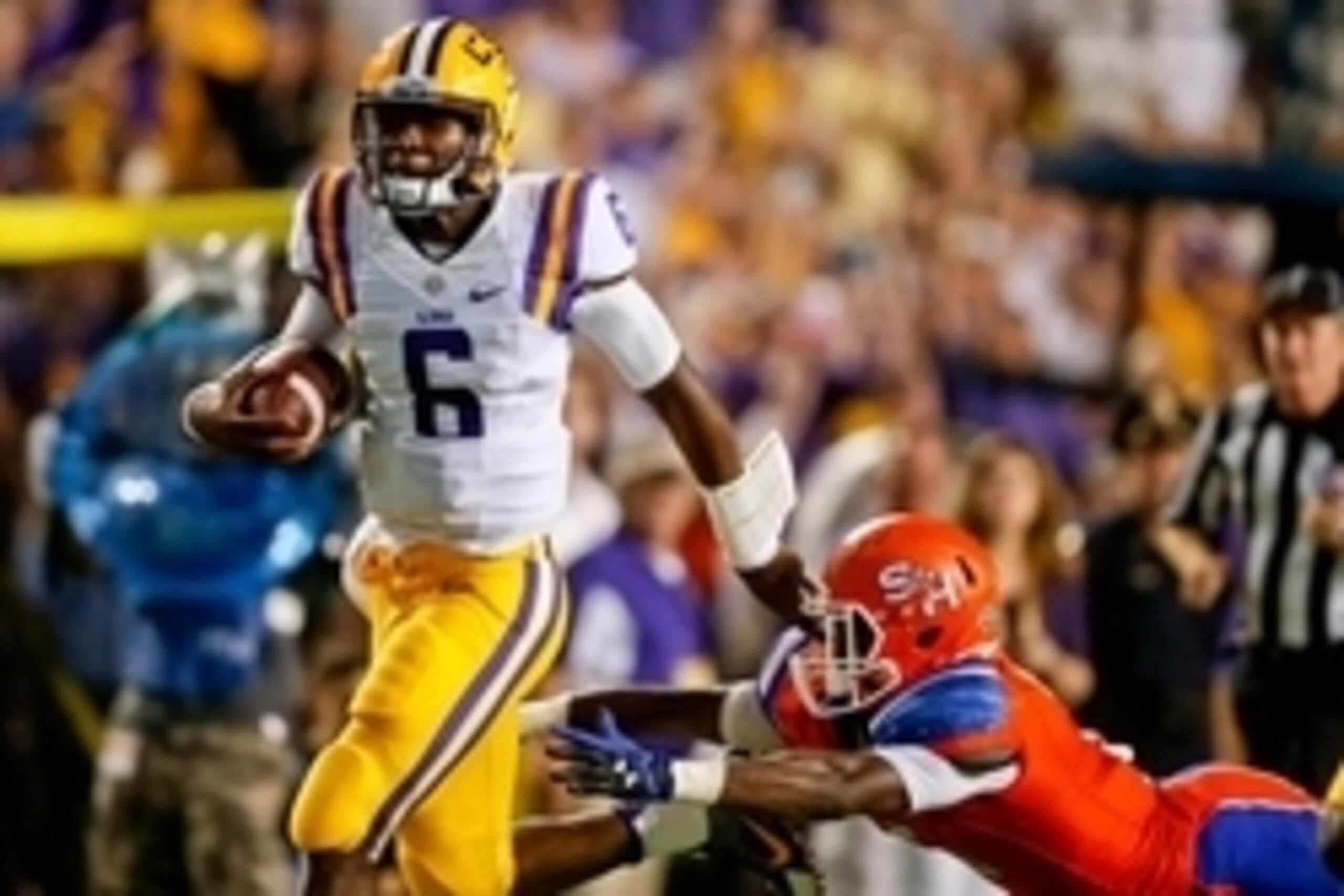 Sep 6, 2014; Baton Rouge, LA, USA; LSU Tigers quarterback Brandon Harris (6) runs past Sam Houston State Bearkats cornerback Mikell Everette (6) for a touchdown during the first half of a game at Tiger Stadium. Mandatory Credit: Derick E. Hingle-USA TODAY Sep 6, 2014; Baton Rouge, LA, USA; LSU Tigers quarterback Brandon Harris (6) runs past Sam Houston State Bearkats cornerback Mikell Everette (6) for a touchdown during the first half of a game at Tiger Stadium. Mandatory Credit: Derick E. Hingle-USA TODAY