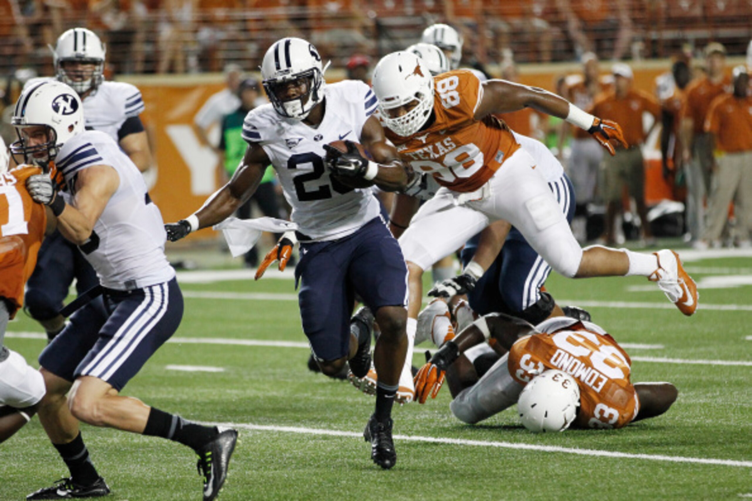 AUSTIN, TX - SEPTEMBER 6:  Adam Hine #28 of the BYU Cougars runs for his second touchdown against the Texas Longhorns on September 6, 2014 at Darrell K Royal-Texas Memorial Stadium in Austin, Texas. (Photo by Chris Covatta/Getty Images)