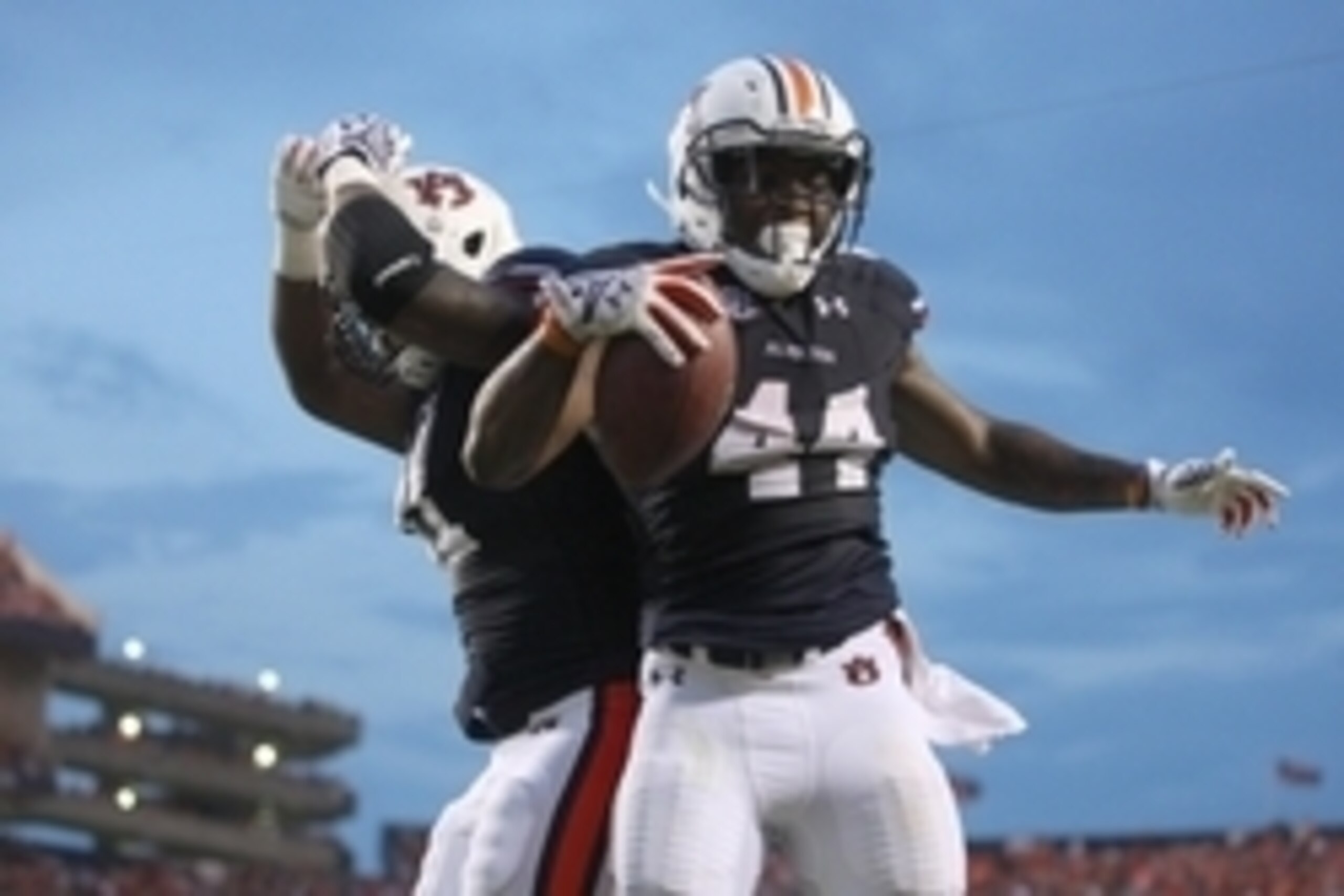 Sep 6, 2014; Auburn, AL, USA;  Auburn Tigers running back Cameron Artis-Payne (44) celebrates a touchdown with tight end Brandon Fulse (11) during the first half against the San Jose State Spartans at Jordan Hare Stadium. Mandatory Credit: John Reed-USA T